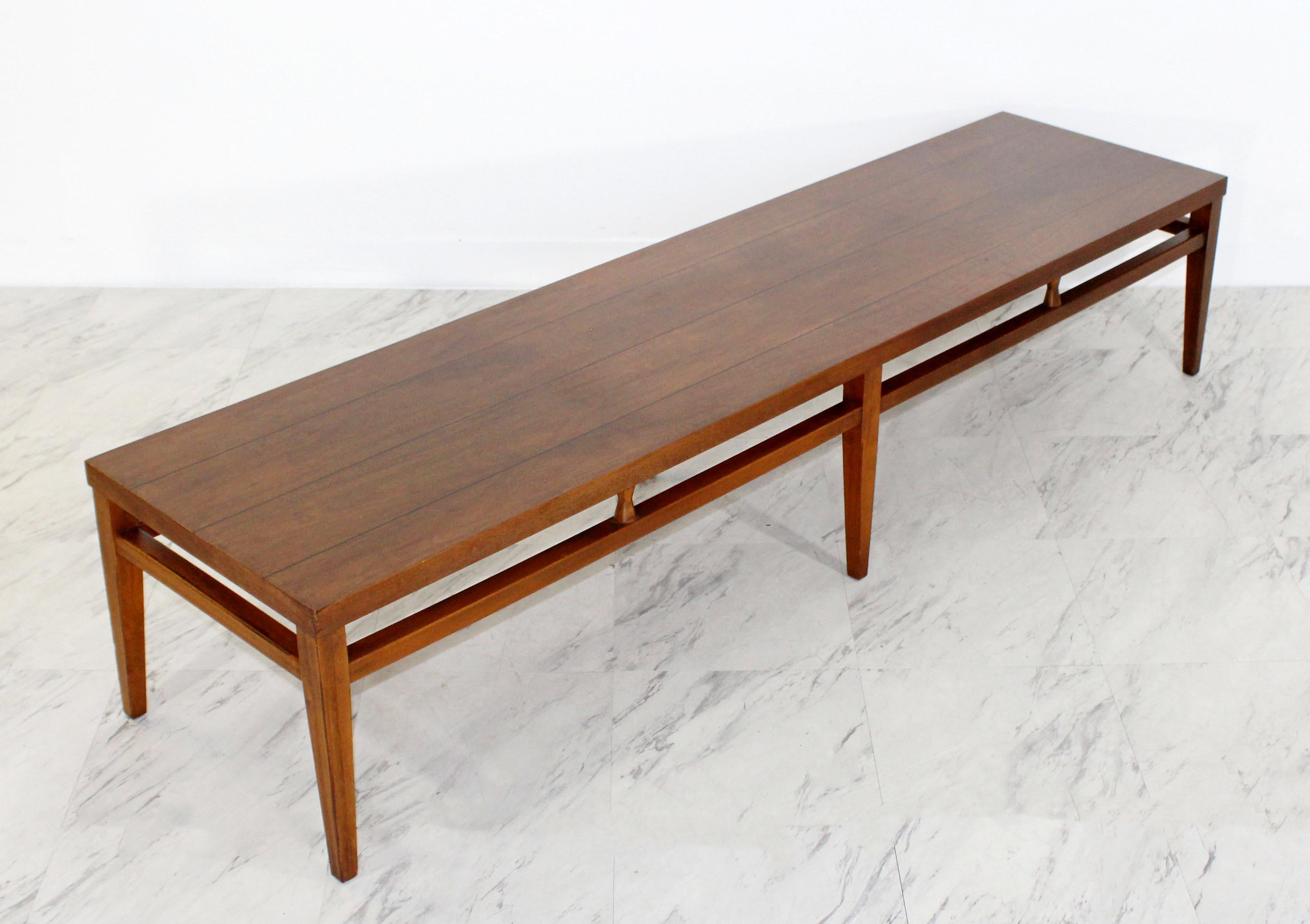 For your consideration is a lovely, long, low coffee table bench, from the Tuxedo line by Lane, circa the 1950s. In excellent condition. The dimensions are 68