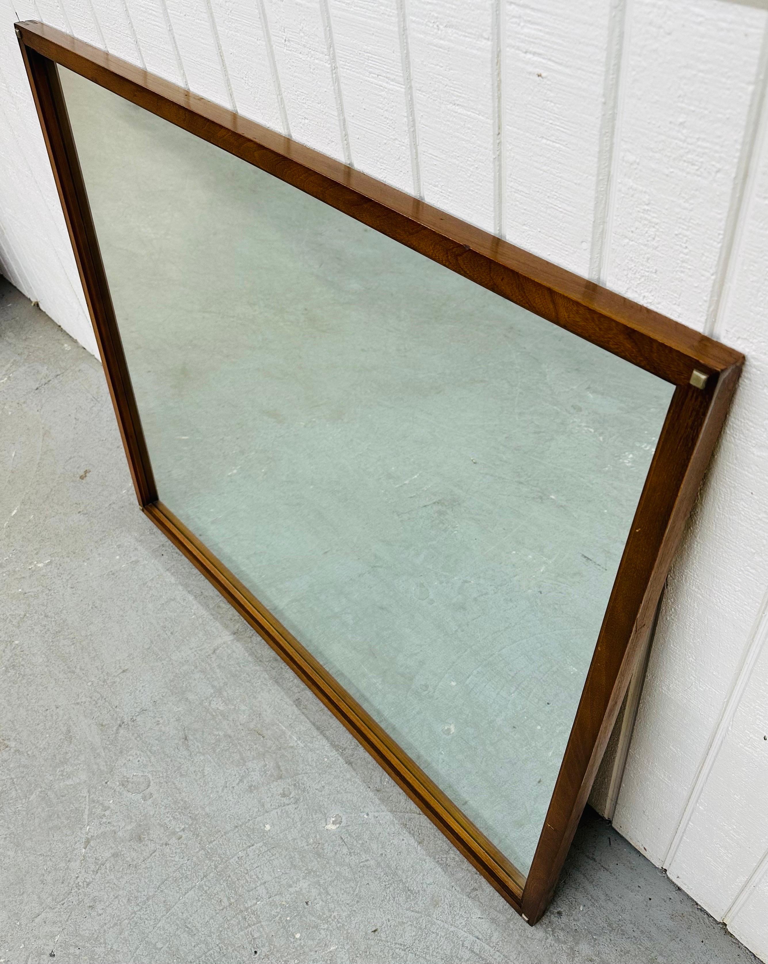 This listing is for a Mid-Century Modern Lane Tuxedo Walnut Mirror. Featuring a straight line design, square nails on each corner, and a beautiful walnut finish. This is an exceptional combination of quality and design by Lane!