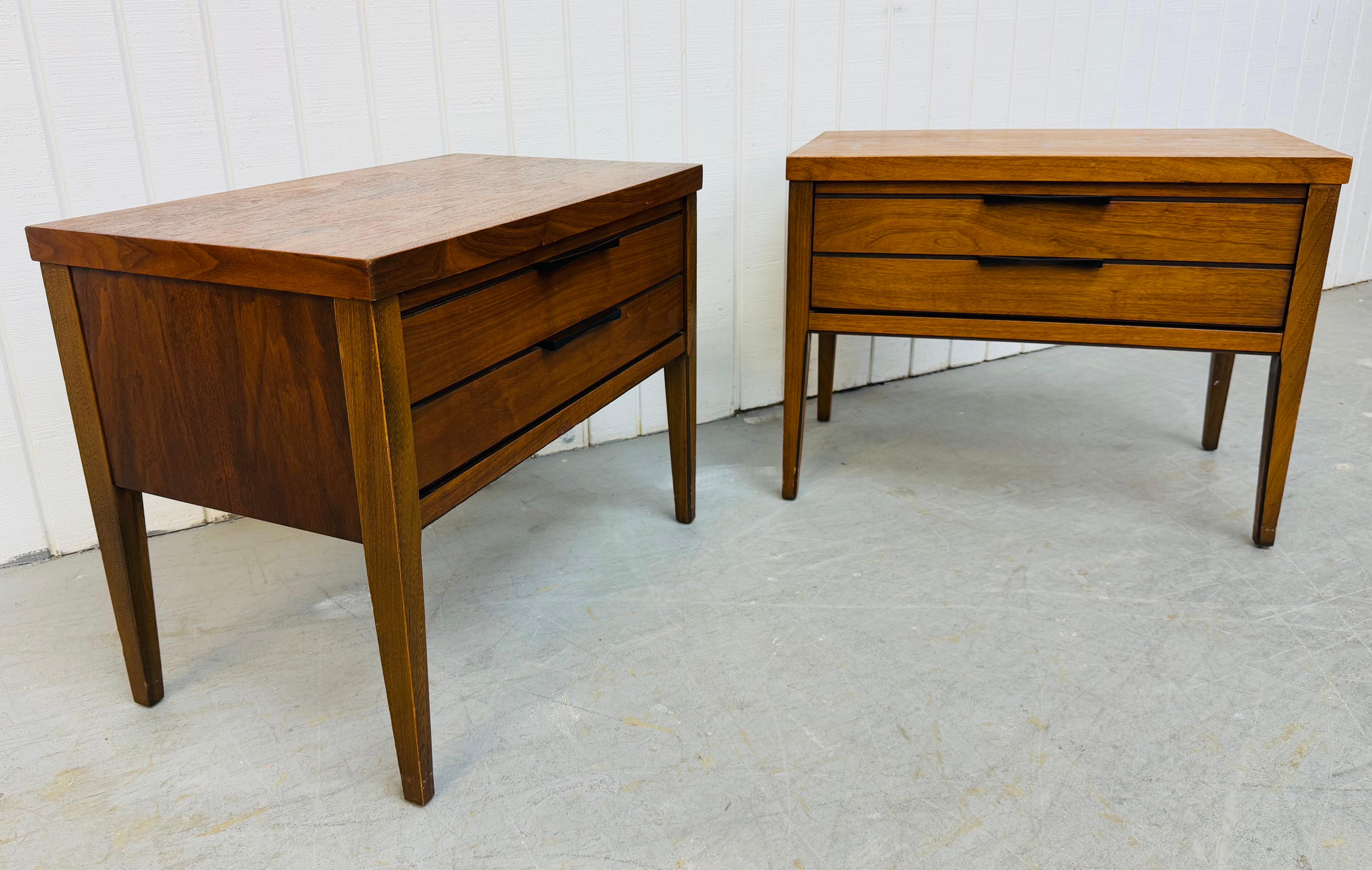 This listing is for a pair of Mid-Century Modern Lane Tuxedo Walnut Nightstands. Featuring a straight line design, single drawer with original black Tuxedo hardware, long modern legs, rosewood inlay on the top, and a beautiful walnut finish. This is