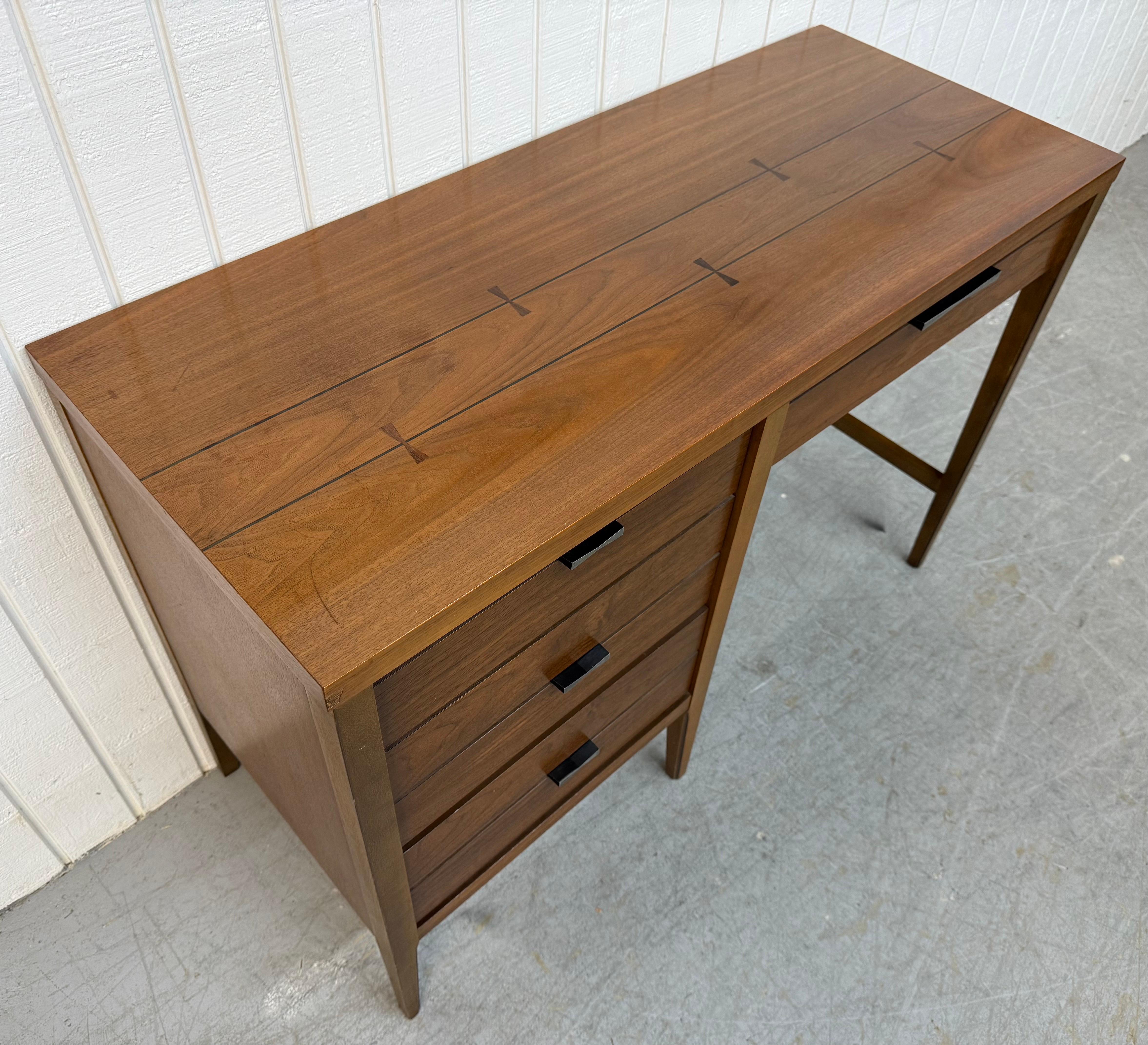 This listing is for a Mid-Century Modern Lane Tuxedo Walnut Writing Desk. Featuring a straight line design, rectangular top with rosewood inlay, three drawers for storage, original black metal hardware, modern legs, and a beautiful walnut finish.