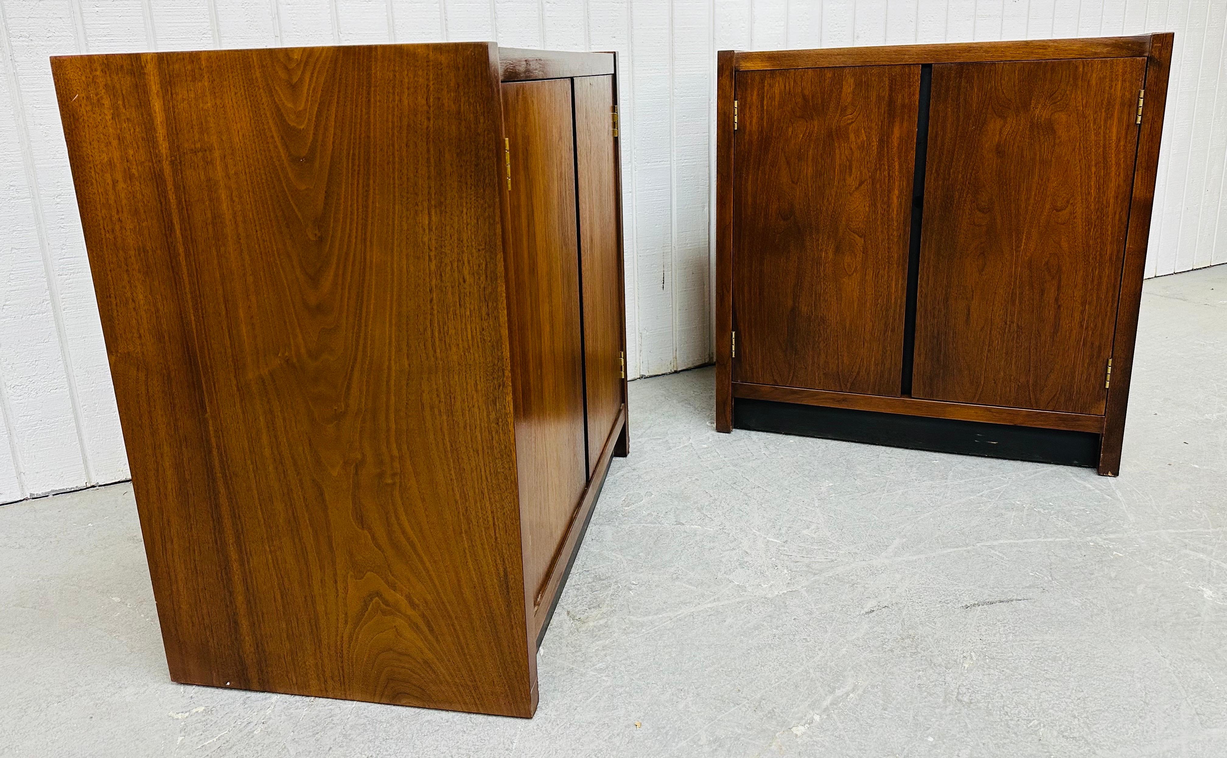 This listing is for a pair of Mid-Century Modern Lane Walnut Record Cabinets. Featuring a straight line design, walnut frames, two doors that open up to storage space, white laminated tops, and a black trim base. This is an exceptional combination