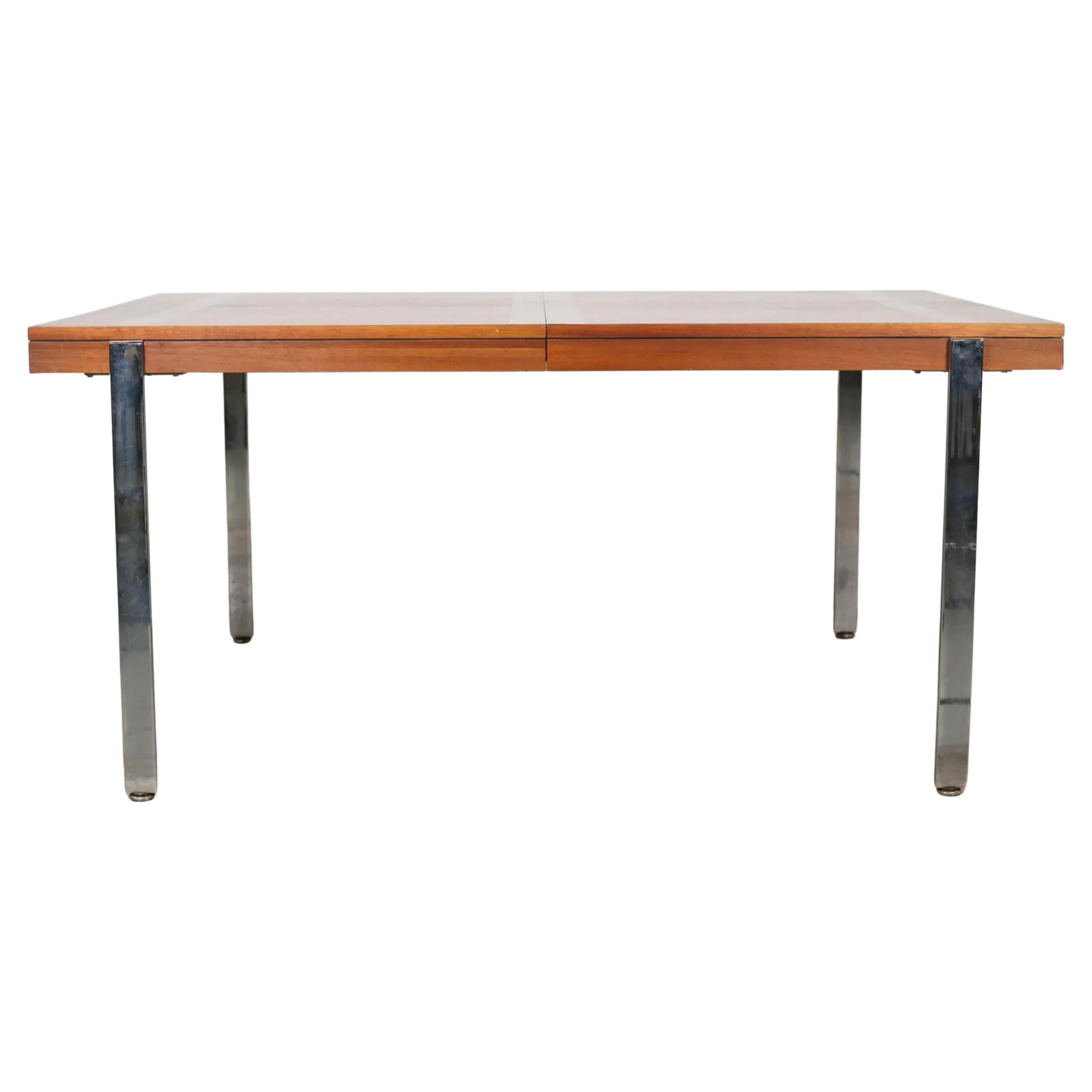 Mid Century Modern dining table by Lane Furniture Co. Altavista, Virginia. Made of walnut with hardwood bands with flat bar chrome legs. Lane label and on underside of table. Table comes with 2 Leaves. Each leaf is 18