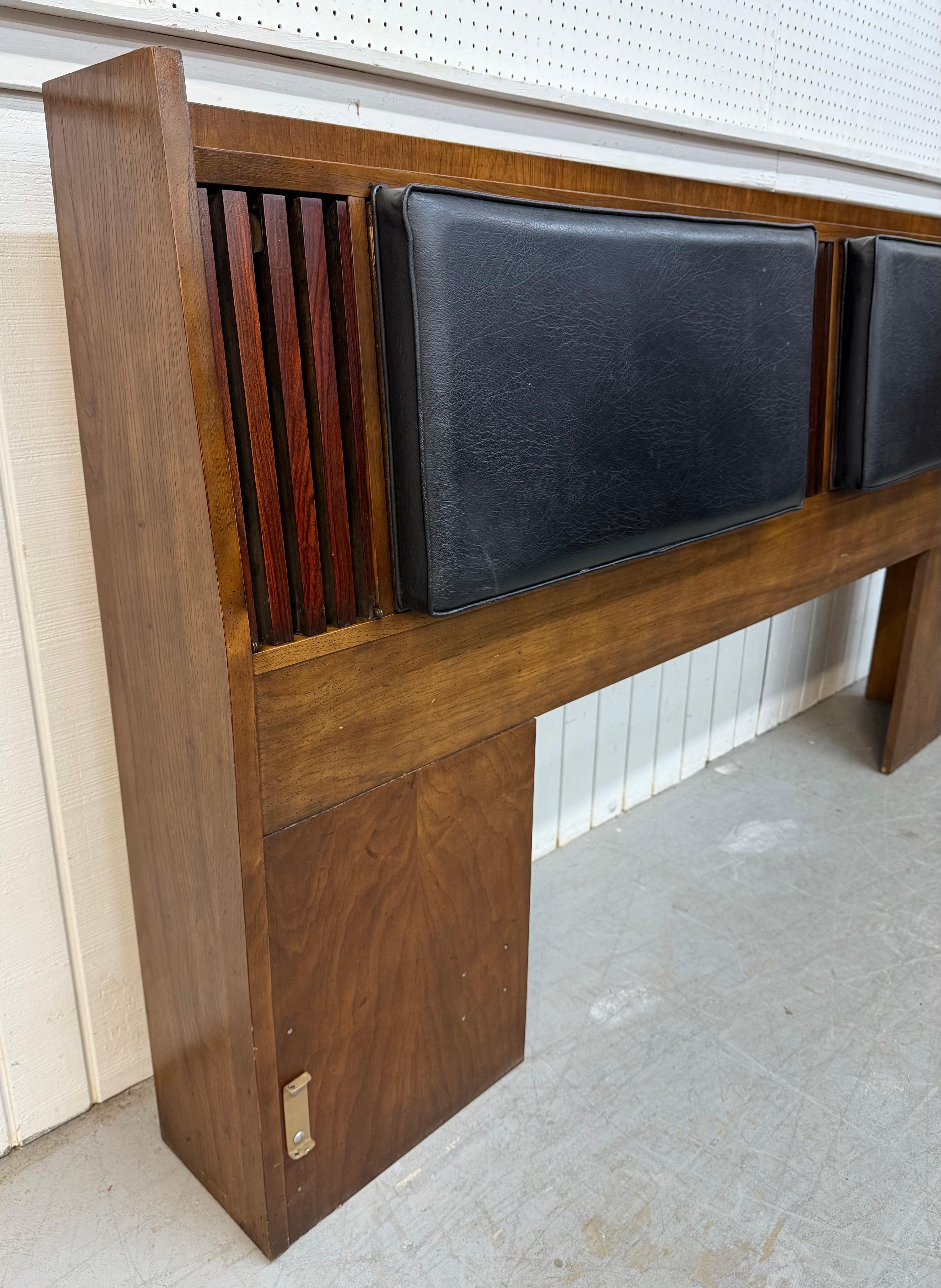 This listing is for a Mid-Century Modern Lane Walnut & Rosewood King Size Headboard. Featuring a straight line design, wooden frame, rosewood accent, black leather padded headboard, and four drop down hidden storage compartments. This is an