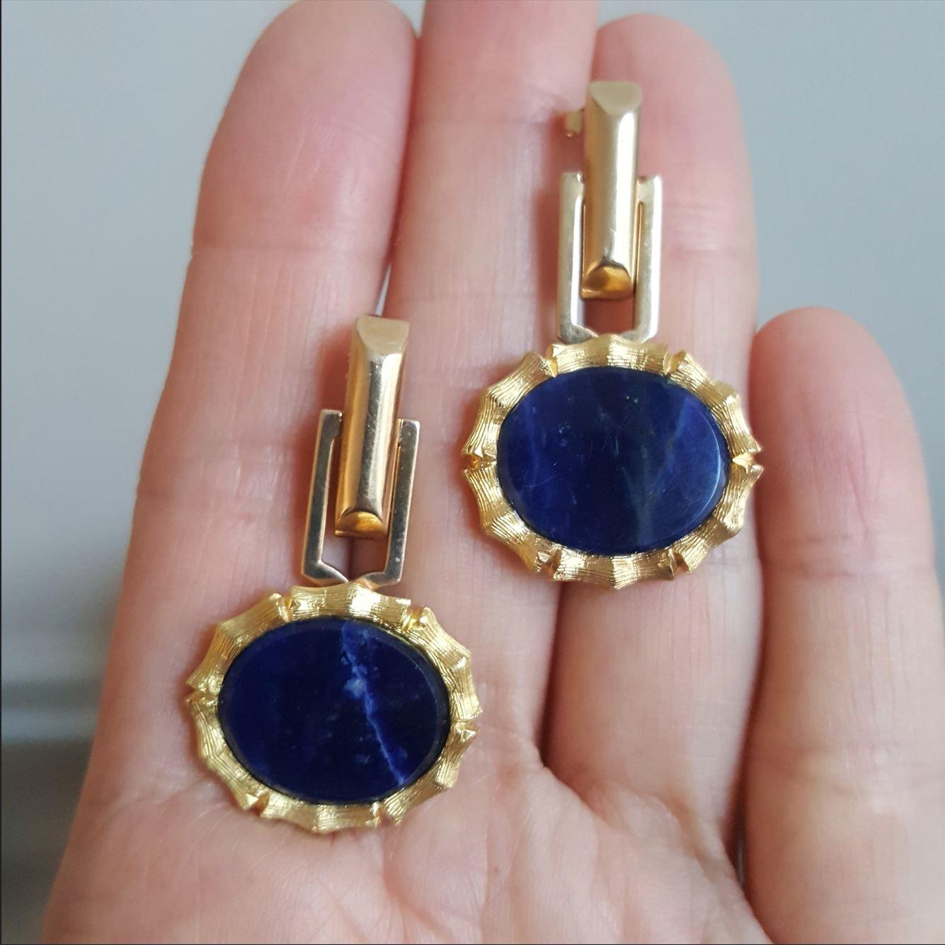 These contemporary, reconstructed Mid-century Modern gold and lapis earrings are from a vintage jewelry collection.

These original mid century modern cufflinks have been converted to earrings. These are beautiful statement earrings for special
