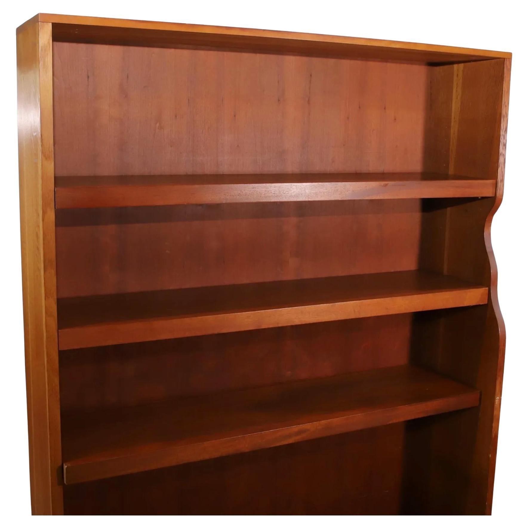 Unique Vintage Mid-Century Modern American Studio Craft Oak and cherry Bookcase. Beautiful bookcase custom made Bookcase Shelf unit with freeform sculptural shaped side and (3) adjustable shelves with copper supports with the lower shelf also with