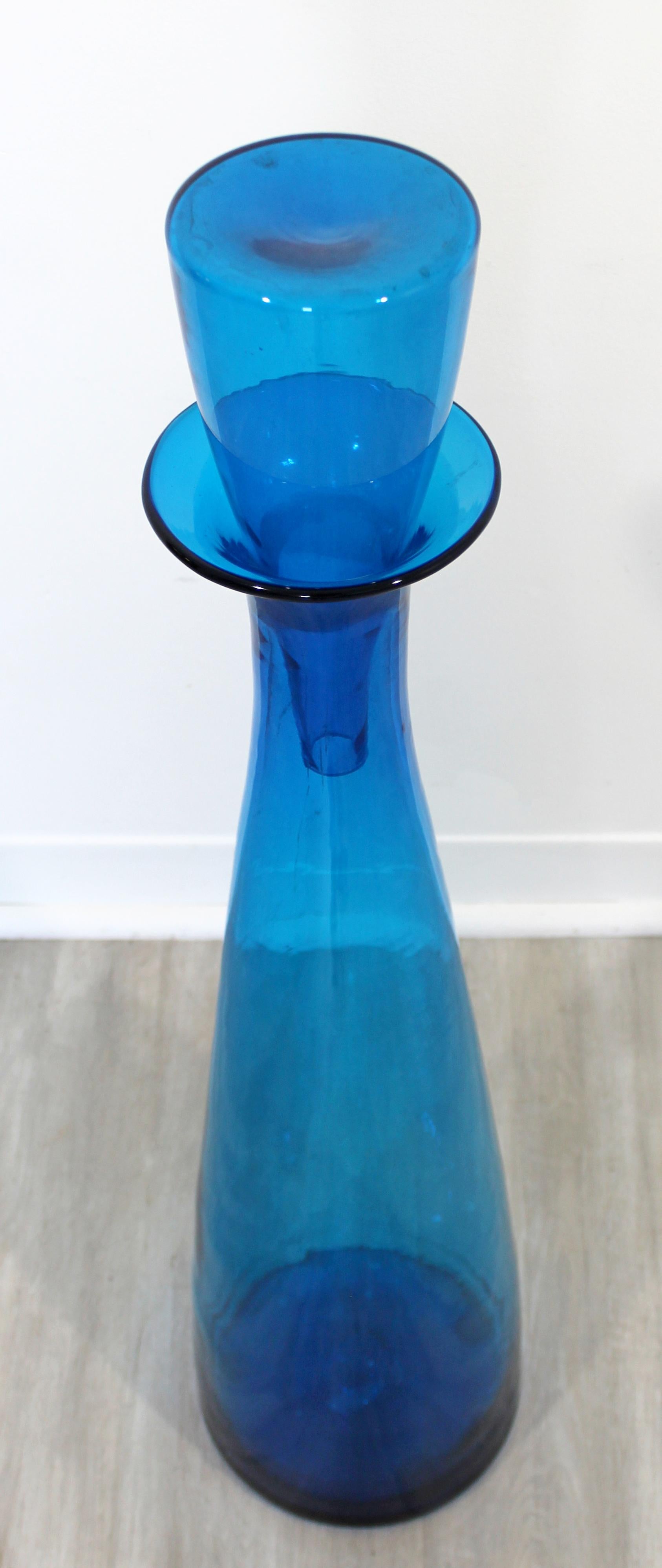 For your consideration is a rare and large, blue Blenko glass vessel with stopper, made in Italy. In excellent condition. The dimensions are 8