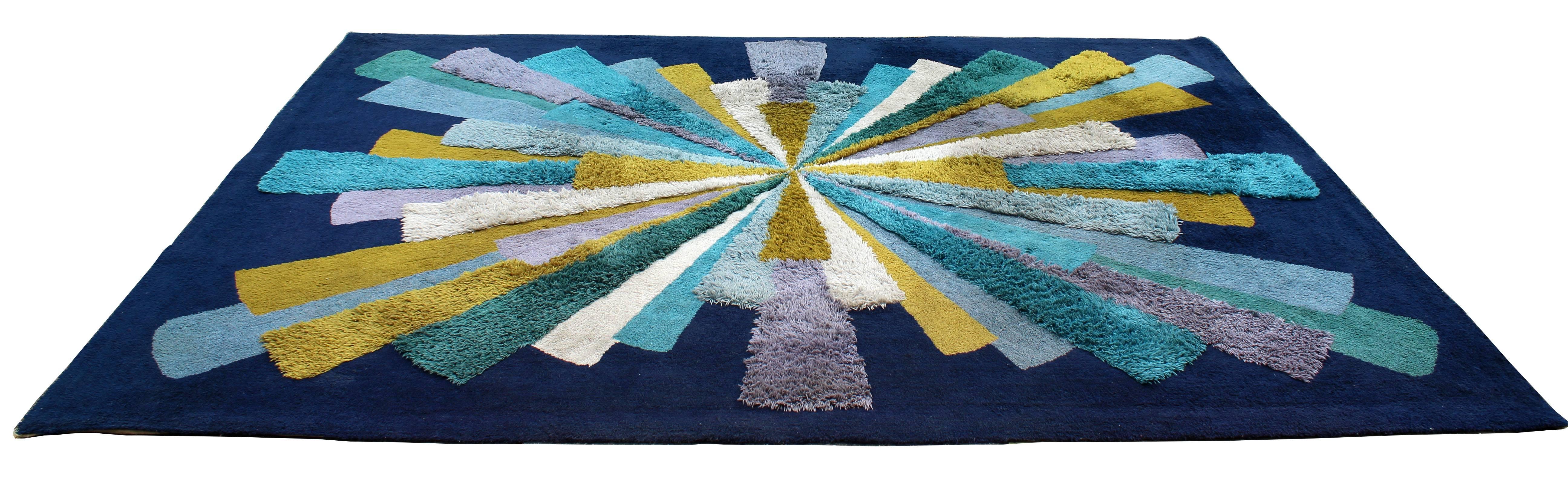 For your consideration is a truly magnificent, blue, purple and yellow area rug or carpet, made in Japan, by New Radia for Providence Import Co, circa 1970s. Hi pile low pile starburst pattern. In excellent condition. The dimensions are 102