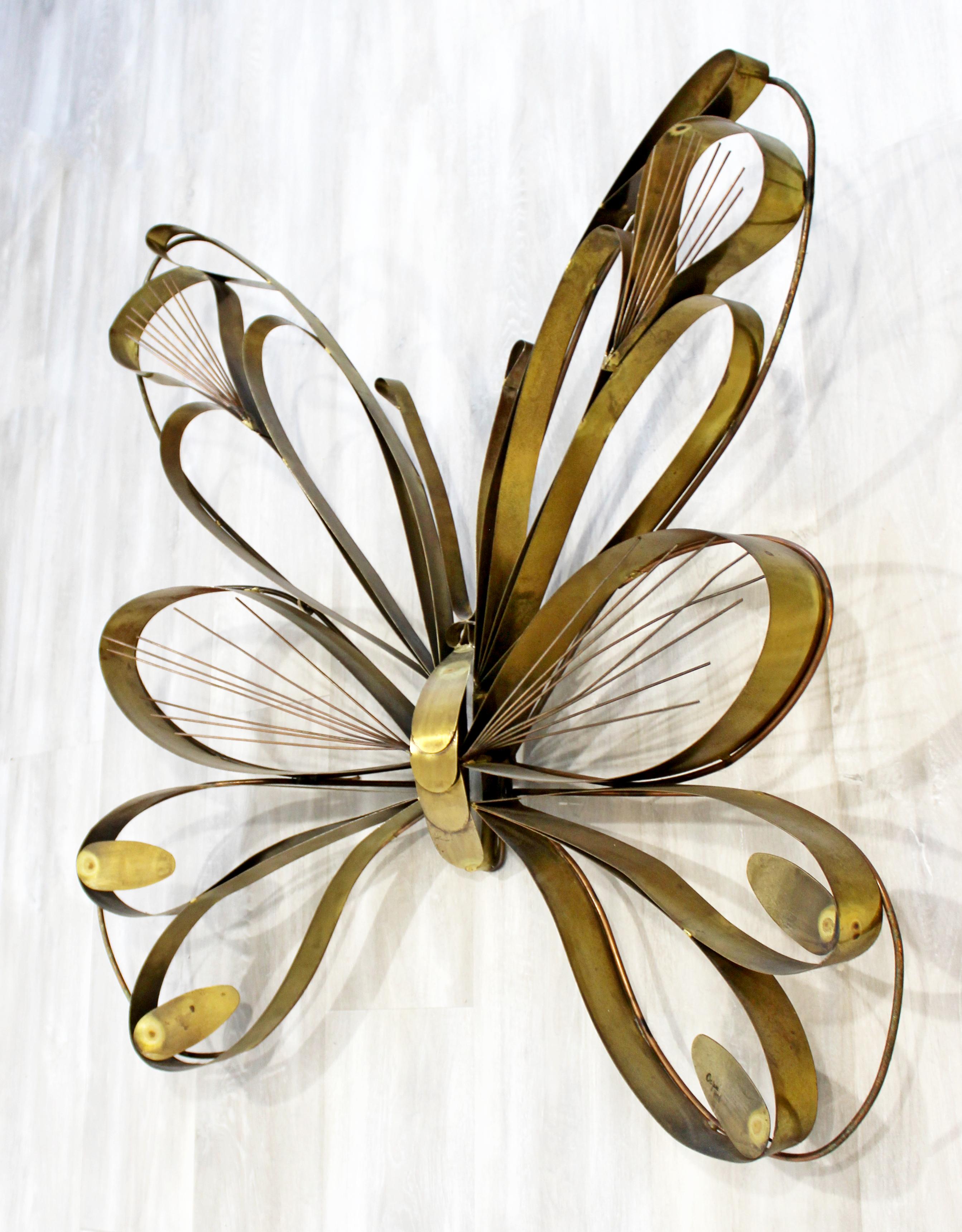 For your consideration is a gorgeous wall sculpture, made of brass and depicting a large butterfly, signed Curtis Jere, dated 1978. In excellent condition. The dimensions are 34