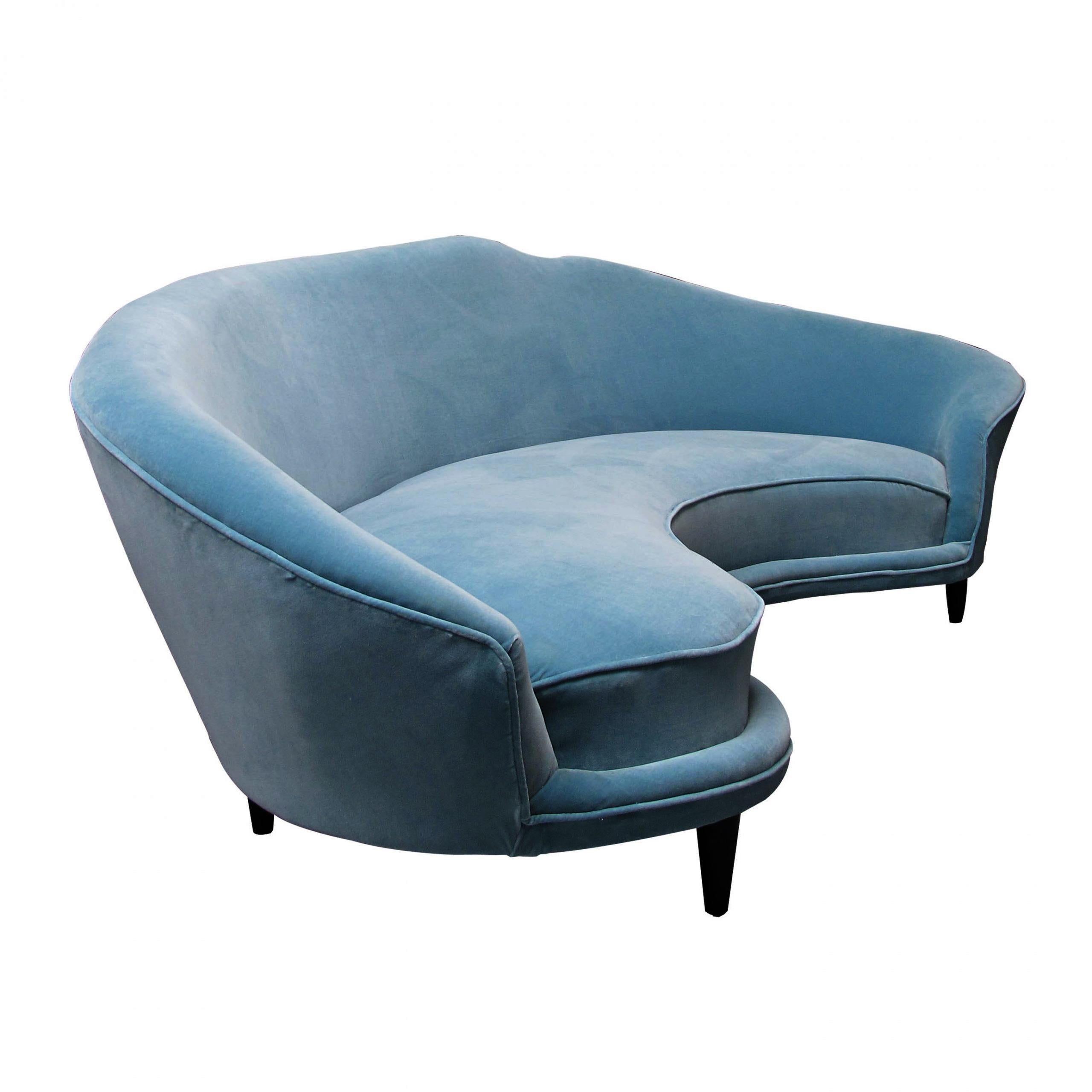 Large Mid-century modern sofa designed in the manner of Frederico Munari with generous curves. The sofa has a deep seating and a slopping backrest and arms, that makes it very comfortable without compromising on this iconic design. The sofa has been