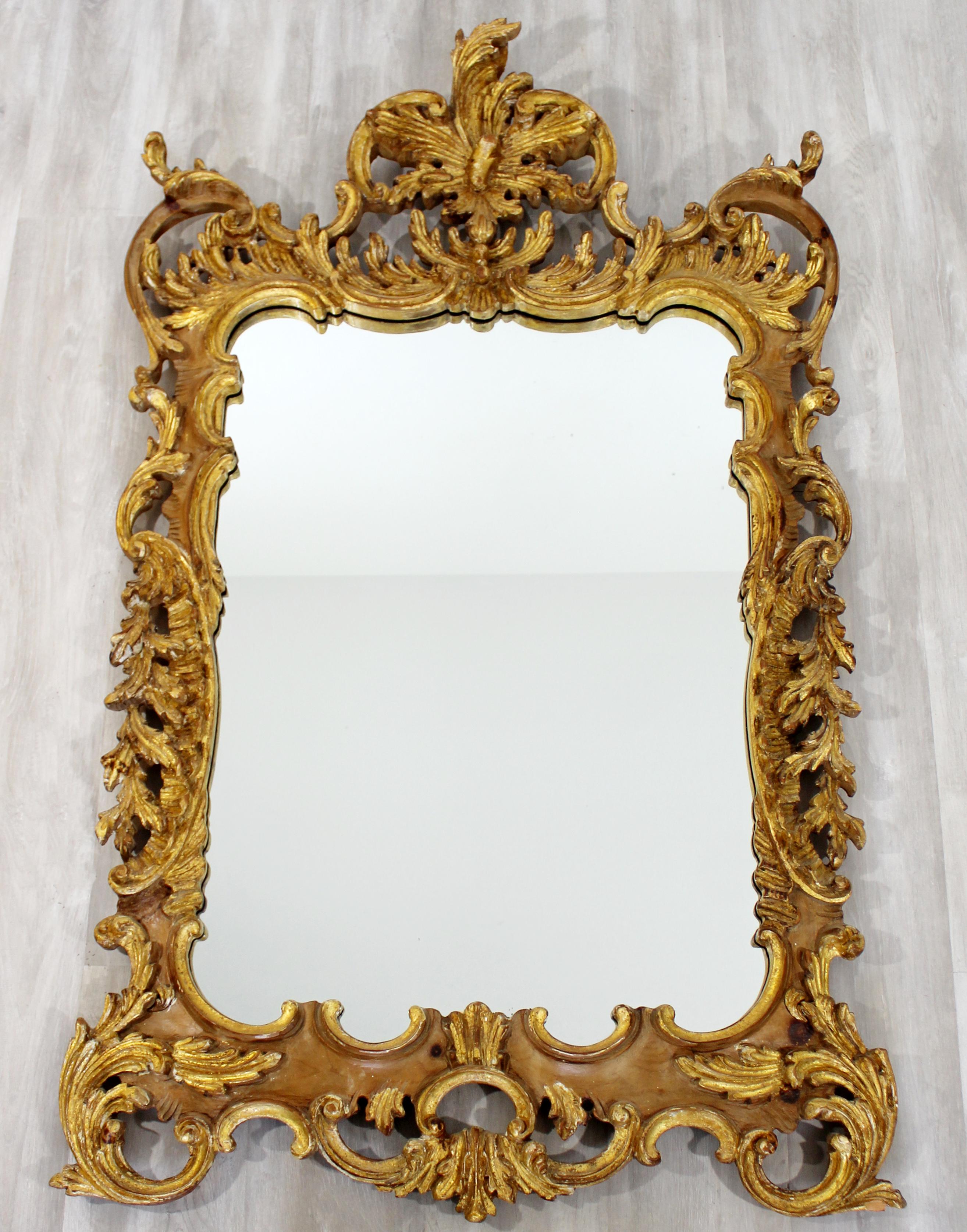 For your consideration is a marvelous, Rococo style, gold gilt hanging wall mirror, by La Barge, circa 1970s. In excellent condition. The dimensions are 43.5