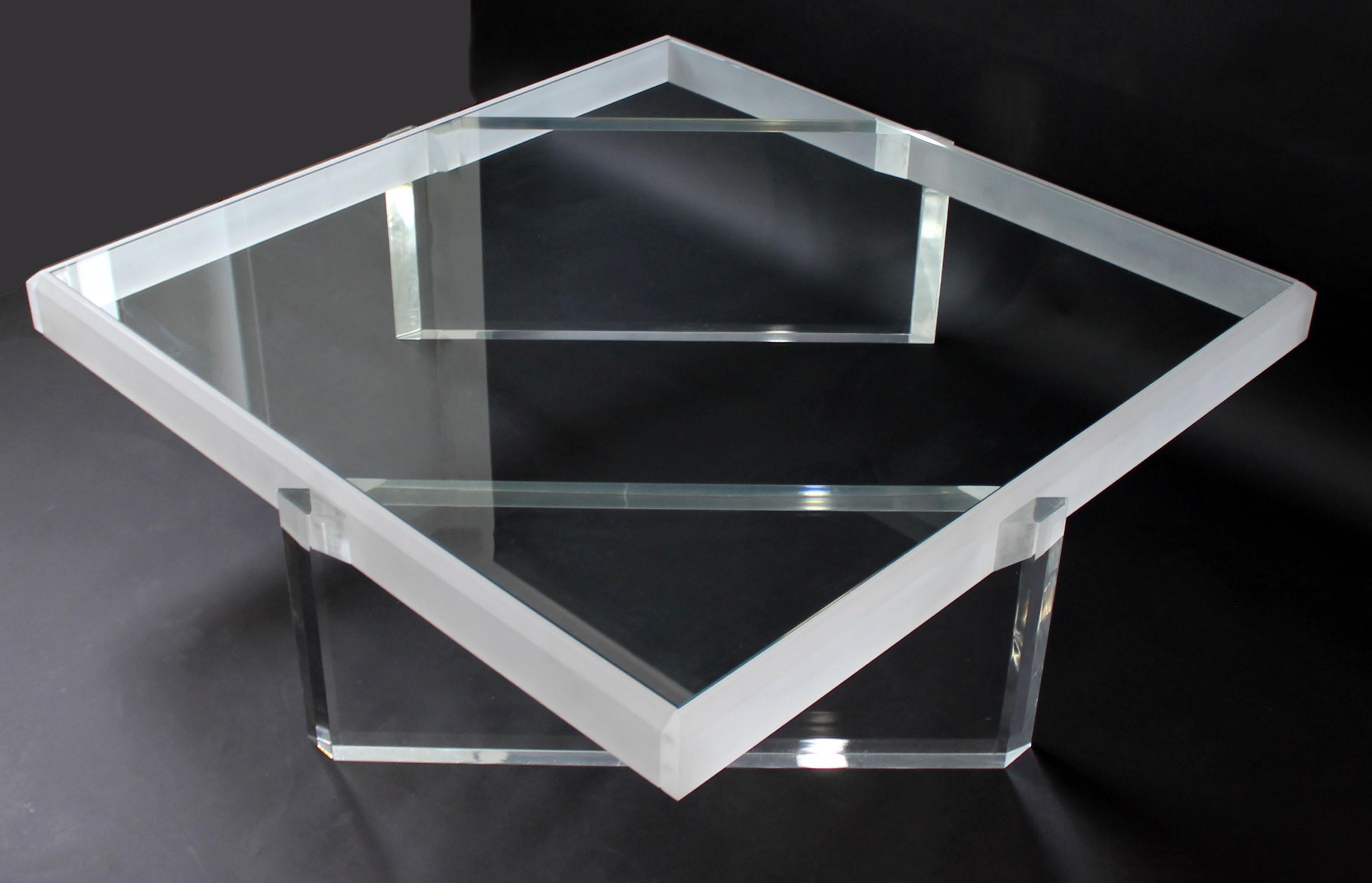 For your consideration is an incredibly lux, large, square coffee table, made of glass and with lucite inserted bases, in the style of Karl Springer of Charles Hollis Jones, circa the 1970s. In excellent condition. The dimensions are 50