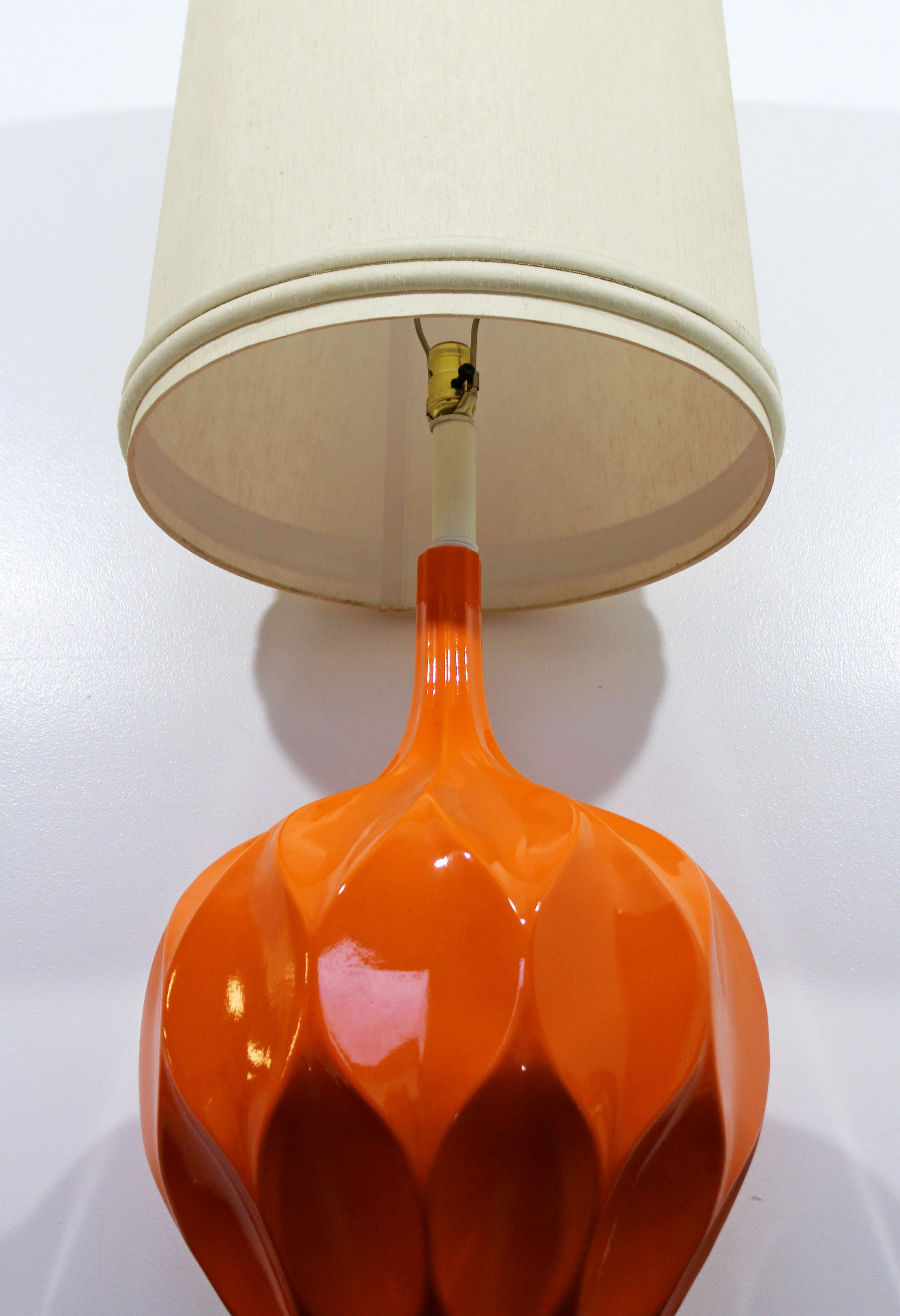 For your consideration is an awesomely funky and fun, large table lamp, made of vibrant orange ceramic, in the style of Verner Panton, circa 1970s. In excellent condition. The dimensions of the lamp without the shade are 16