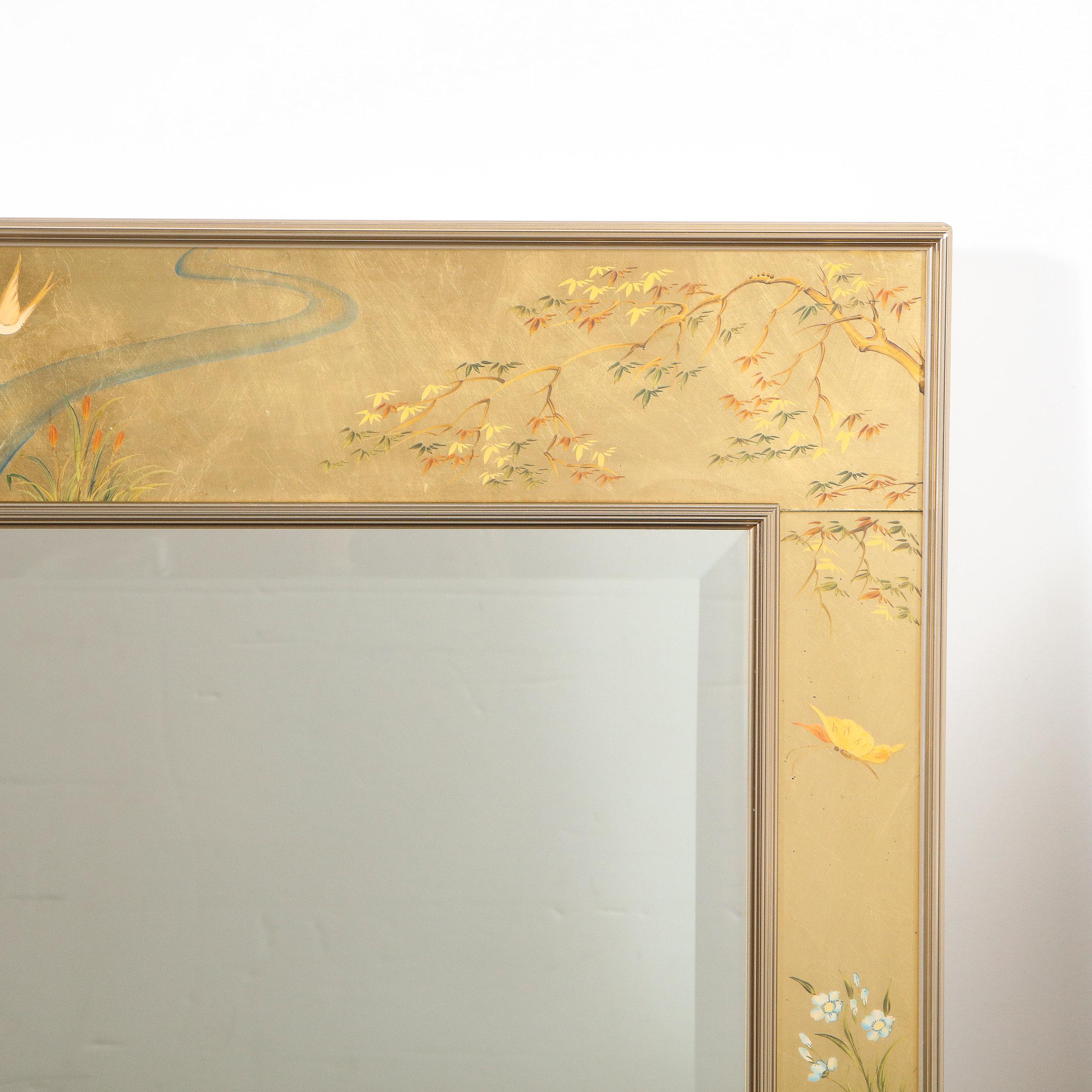 This exquisite chinoiserie reverse hand painted glass, gilt and églomisé mirror was realized by the esteemed American producer, La Barge, circa 1980. The piece features two chromed and reeded rectangular frames with a gilded hand painted chinoiserie