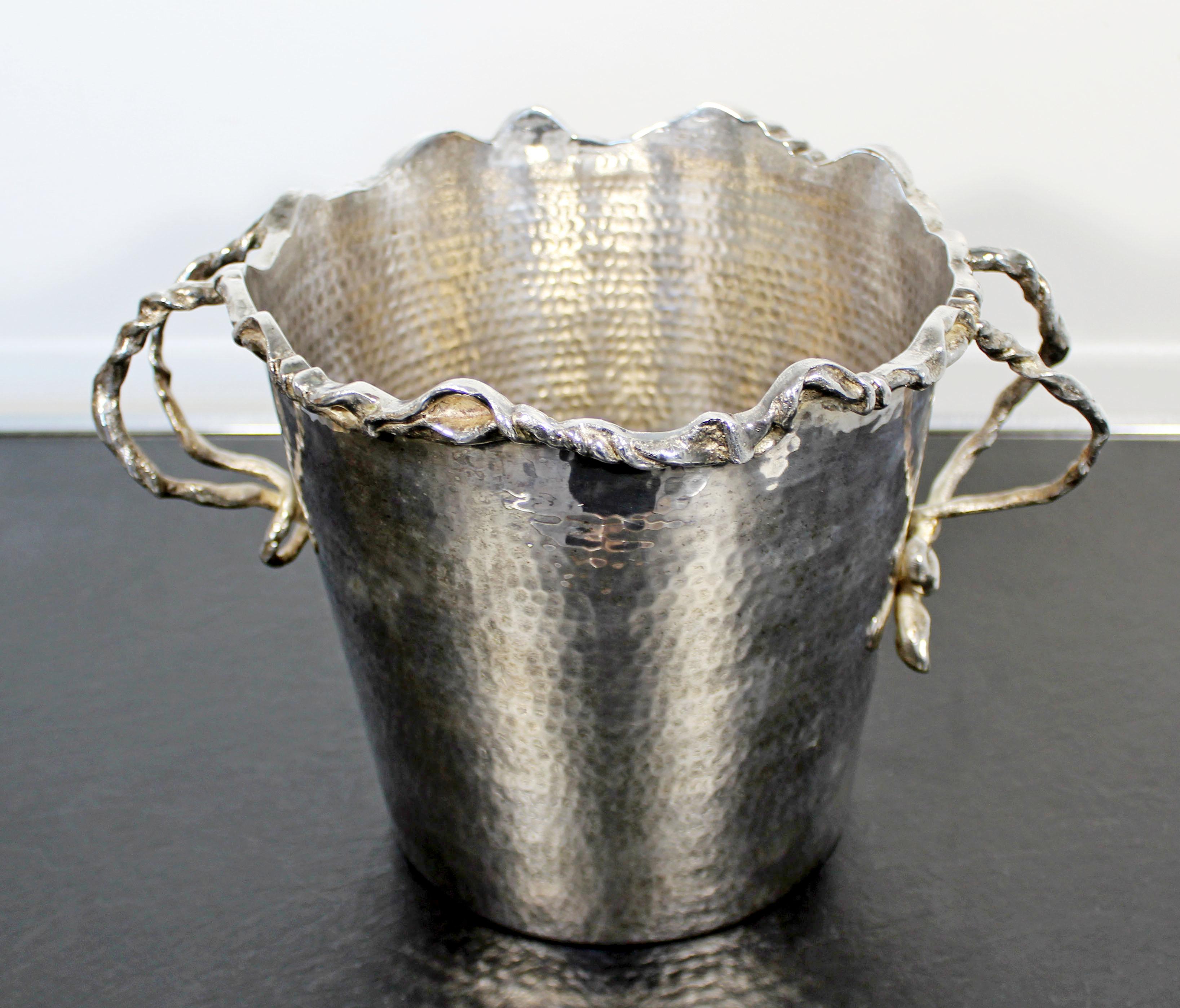 For your consideration is a marvelous, silver plated champagne or ice bucket, with handles, by Michael Aram, circa 1970s-1980s. In excellent condition. The dimensions are 11.5