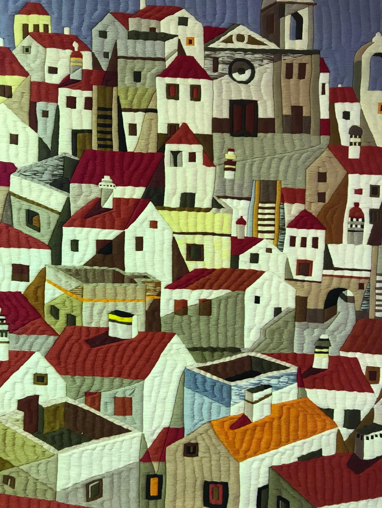 A very beautiful and quite engaging large tapestry or wall hanging by Portuguese artist Abel Bravo da Mata for Galeria Sesimbra in Lisbon, Portugal. This work of an old city landscape is still as vibrant as it was some 65 years ago.

The piece is