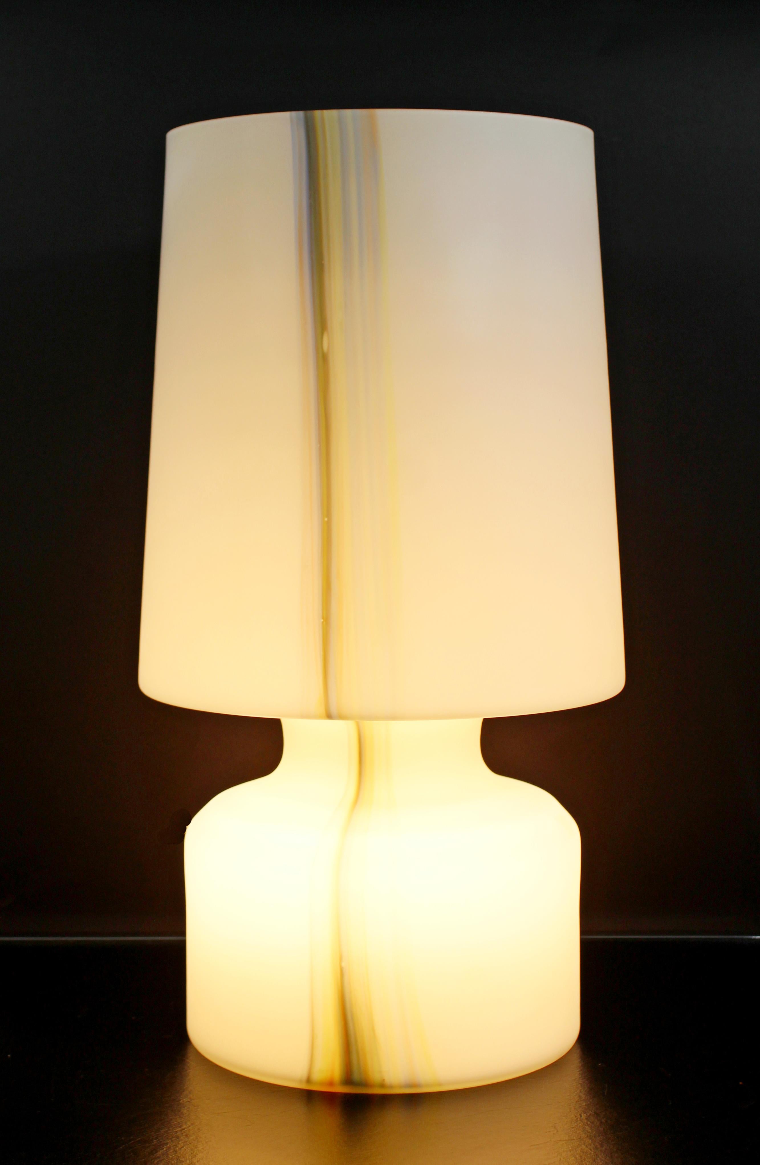 For your consideration is a magnificent, large table lamp, made of a single sheet of white and colored Murano glass, made in Italy, circa 1970s. In excellent condition. The dimensions are 10