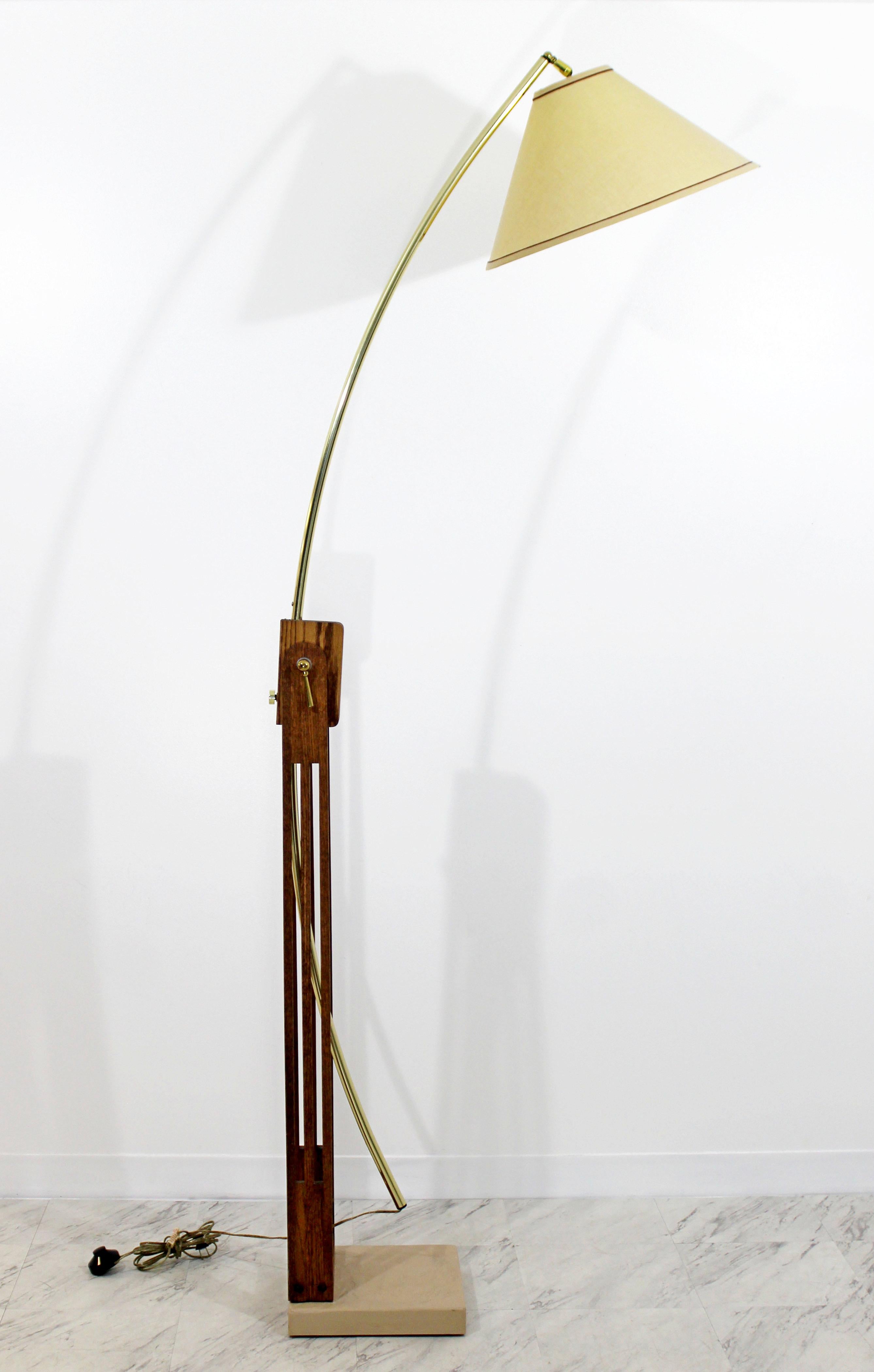 For your consideration is a phenomenal, large, wooden, arc floor lamp, with adjustable head and arm and brass knobs, circa the 1960s. In excellent condition. The dimensions are 84