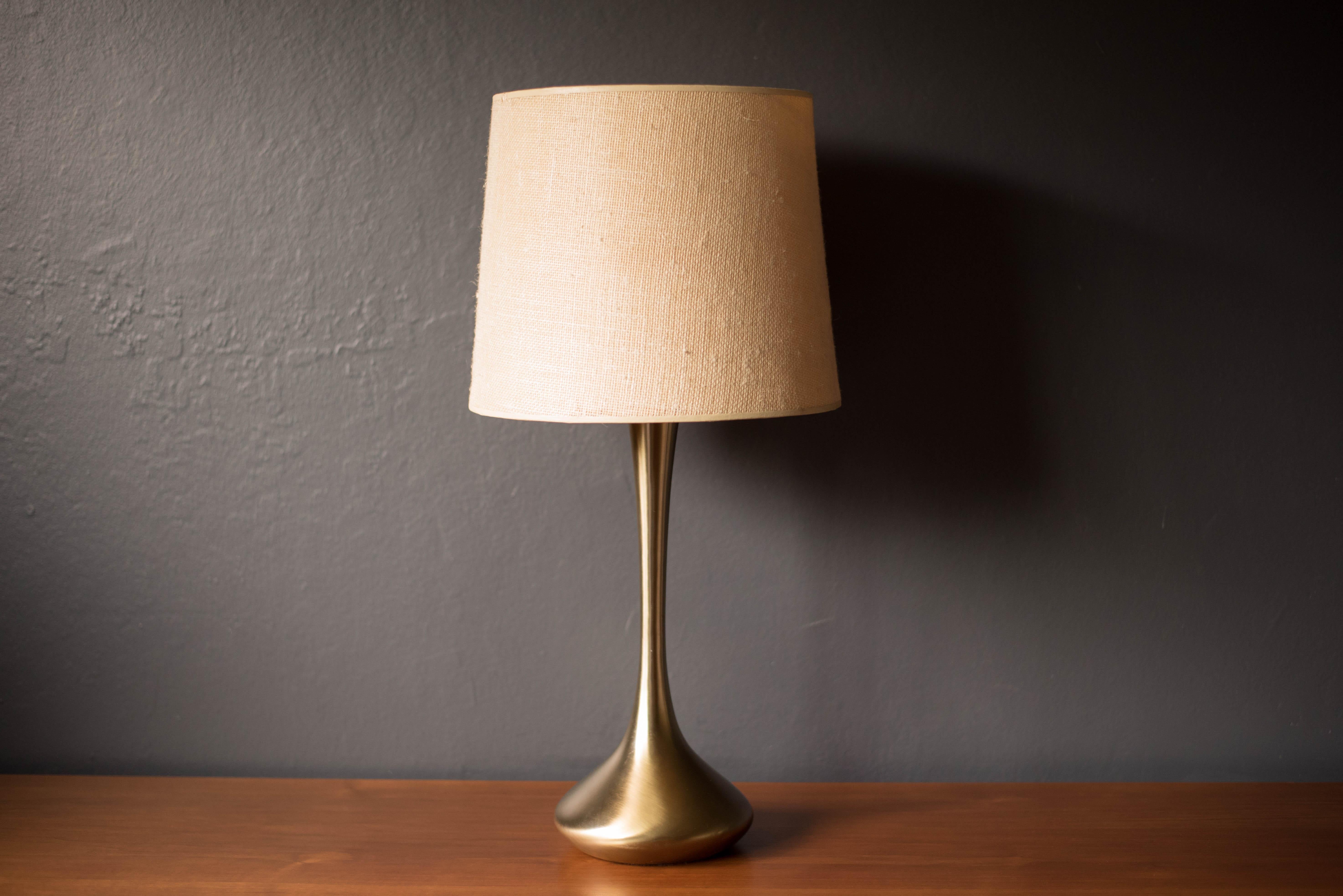 Vintage accent table light manufactured by Laurel Lamp Co. in brass. Features a sculptural teardrop style weighted base and signature finial. Shade is not included. 

 