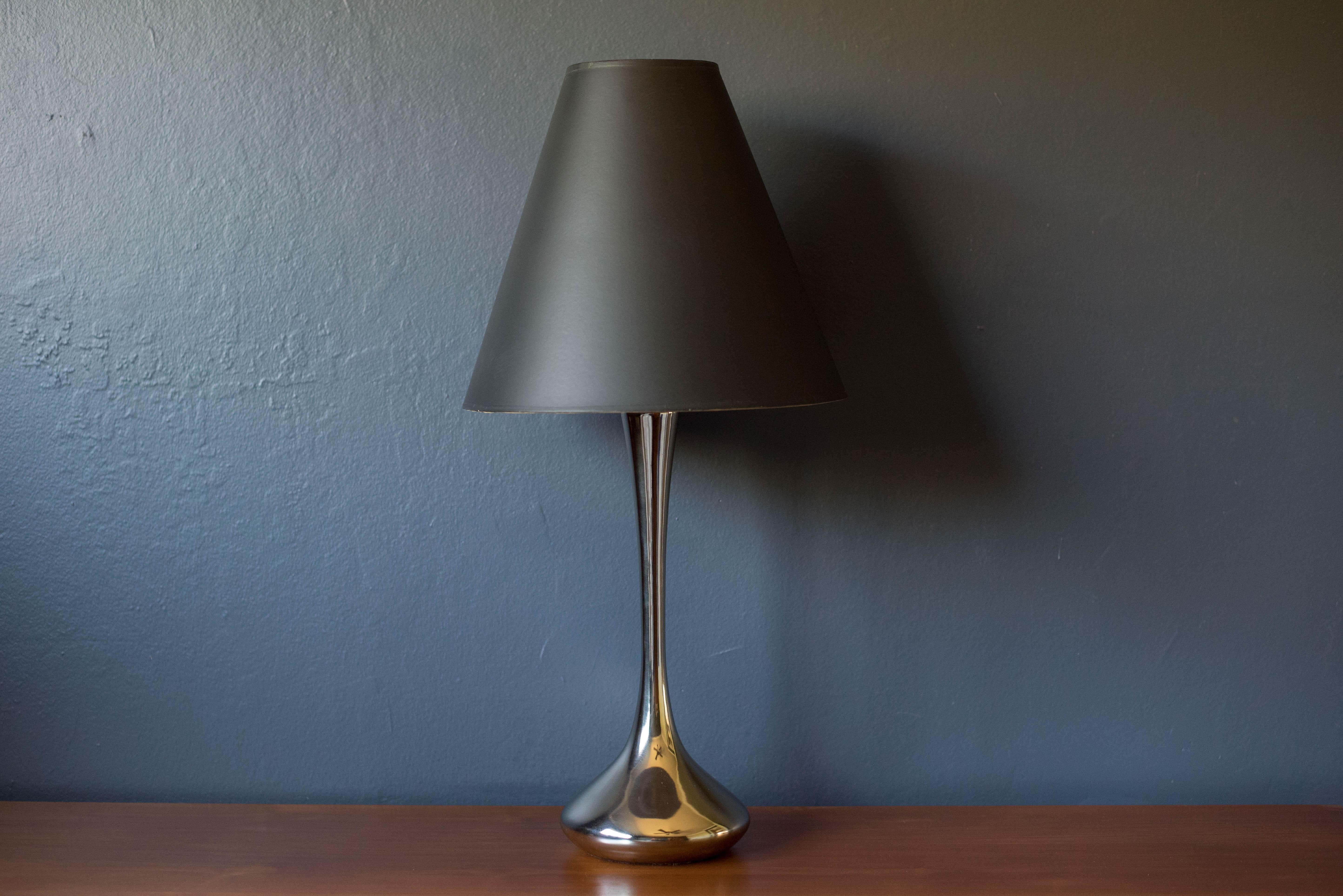 Vintage accent table light manufactured by Laurel Lamp Co in polished chrome. Features a sculptural teardrop style weighted base equipped with a three way switch. Includes the original black paper shade. 

Shade 17