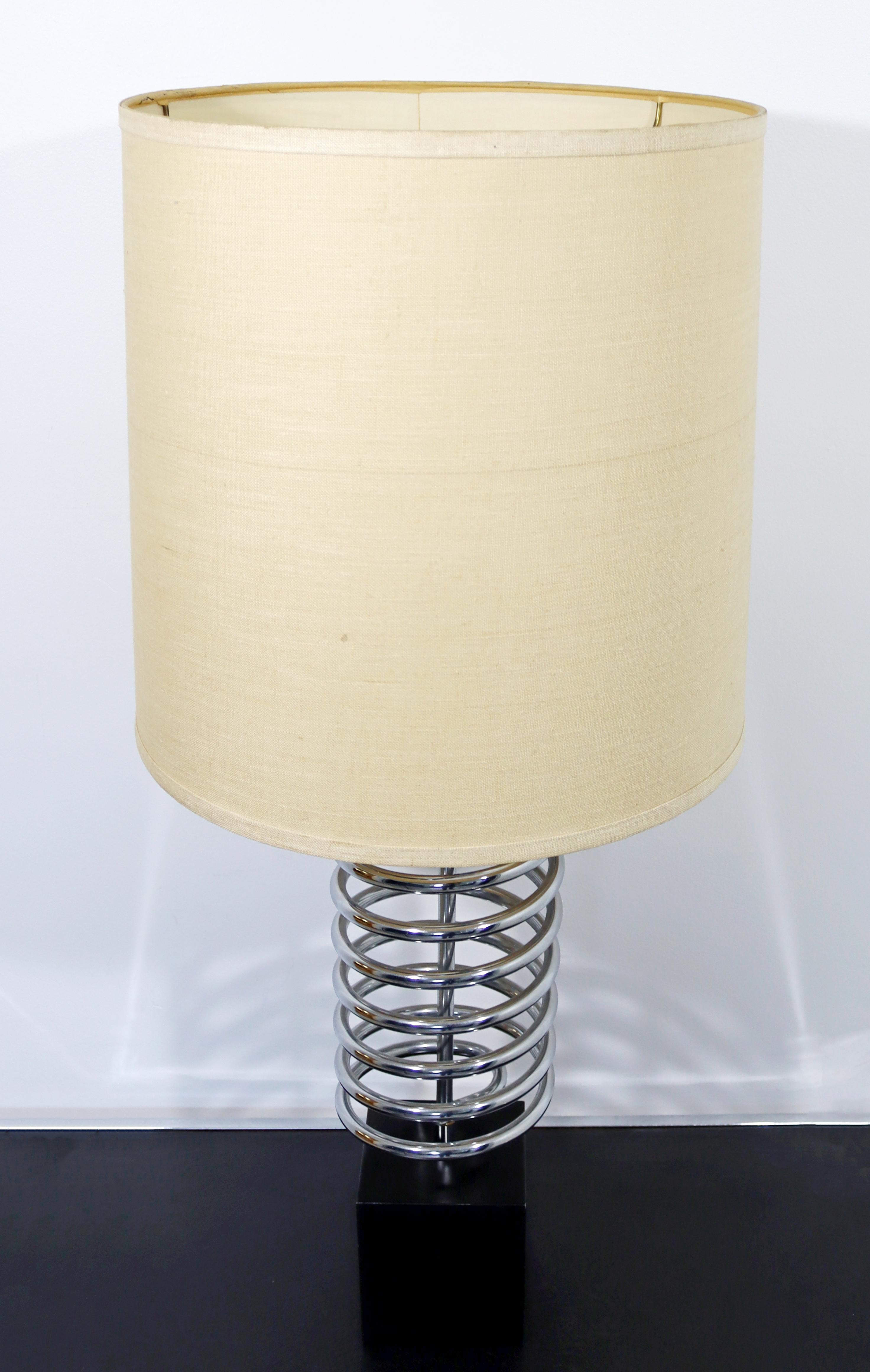 For your consideration is a fantastic, chrome spring table lamp, with original shade and finial, by Laurel Lamp Co, circa the 1970s. In very good vintage condition. The dimensions of the lamp are 7