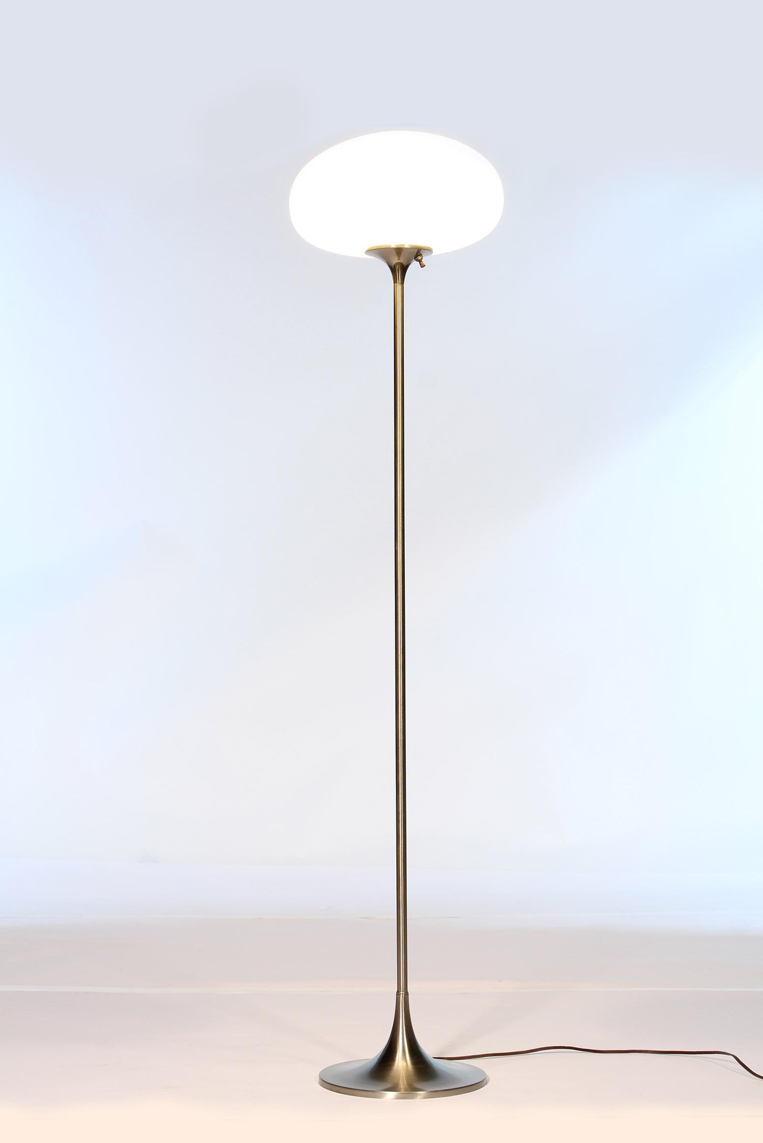 Authentic 1970s Laurel floor lamp with frosted glass mushroom globe and nickel finish. A few scratches and imperfections here and there and some pitting on base. Measures 56