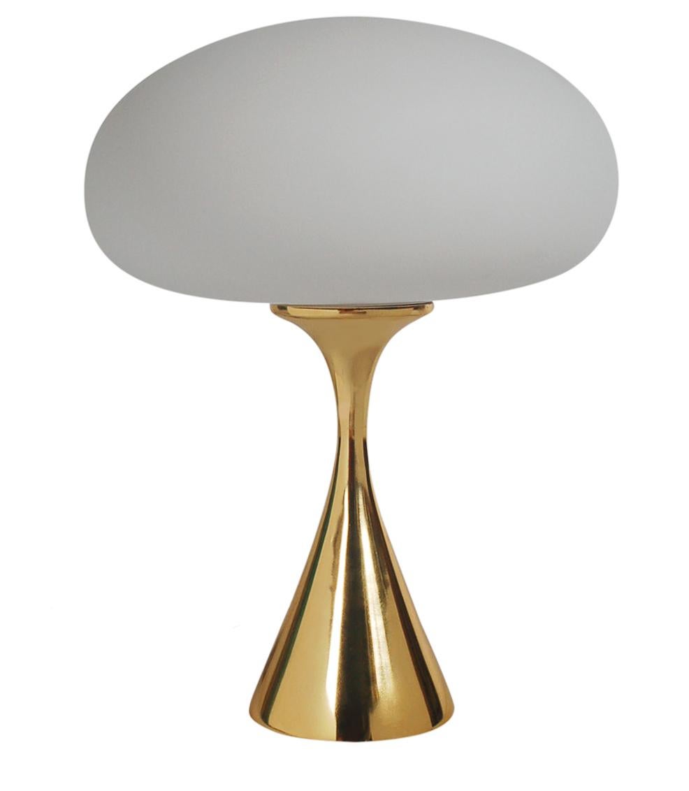 A beautiful and sculptural mushroom lamp produced by Laurel in the 1970s. It features a cast aluminum bases with frosted mushroom shades. It has been fully rewired and ready for immediate use.