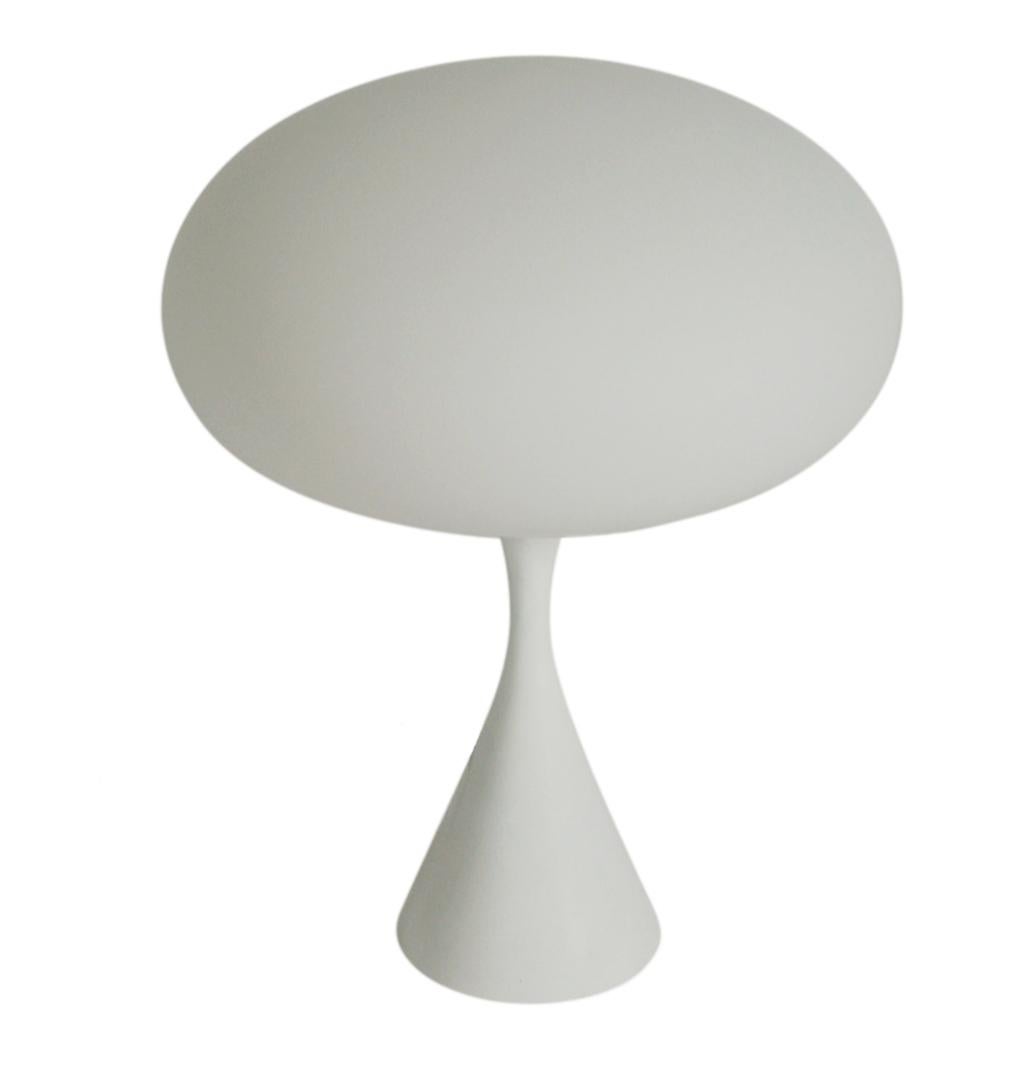 A beautiful and sculptural mushroom lamp produced by Laurel in the 1970s. It features a cast aluminum bases with frosted mushroom shades. It have been fully rewired and ready for immediate use.