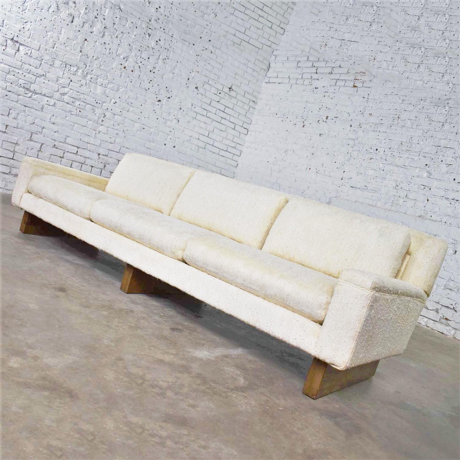 Handsome Mid-Century Modern Lawson style three cushion white sofa from the flair division of Bernhardt Furniture. It is in wonderful vintage condition and wears its original linen-like white nubby fabric. It has been professionally cleaned. However,