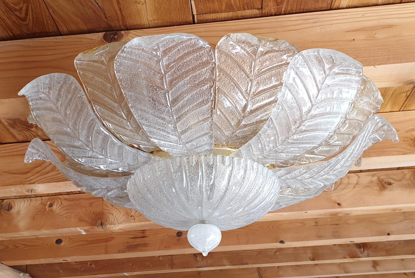 Mid-Century Modern translucent clear and gold Leaf Murano glass flushmount lights by Barovier e Toso, Italy, circa 1960s.
Brass mounts.
Two available. Sold and priced individually.
10 lights each, rewired for the US.
Very good condition.