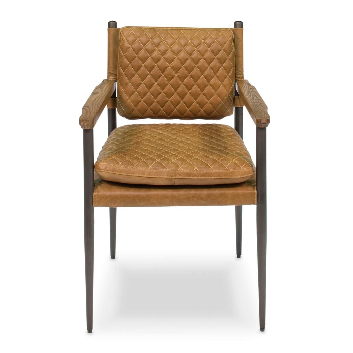 Mid-Century Modern style metal and leather armchair, sleek steel grey frame with wood arms, and quilted leather seat and back. 

Crafted in pure aniline top-grade cow leather in a warm golden brown tone.

Dimensions: 23