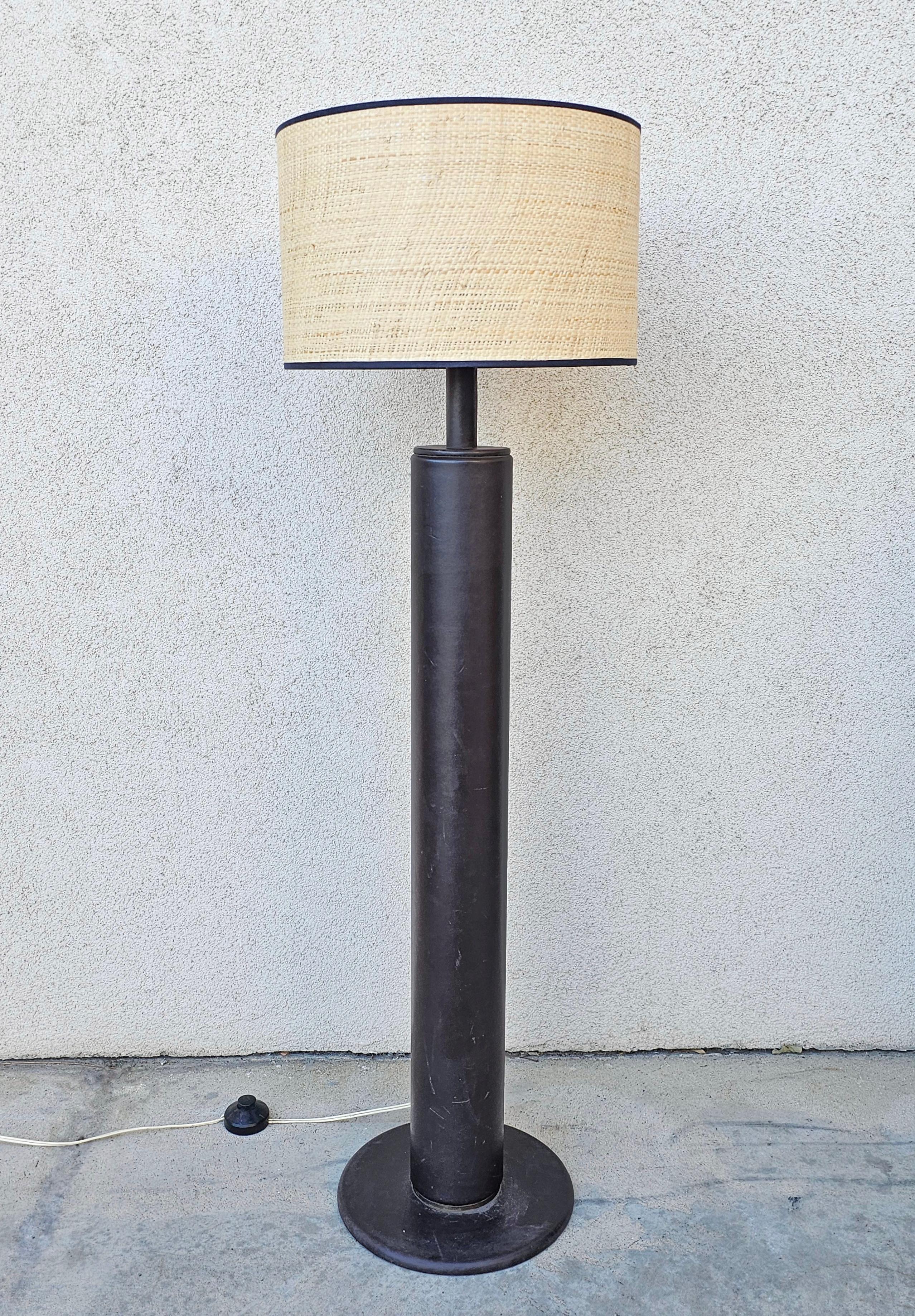 In this listing you will find a very uncommon Mid Century Modern floor lamp which is done in dark brown leather. It features a single light with a bulb model E27, available worldwide. The logo of the manufacturer is attached at the root of the