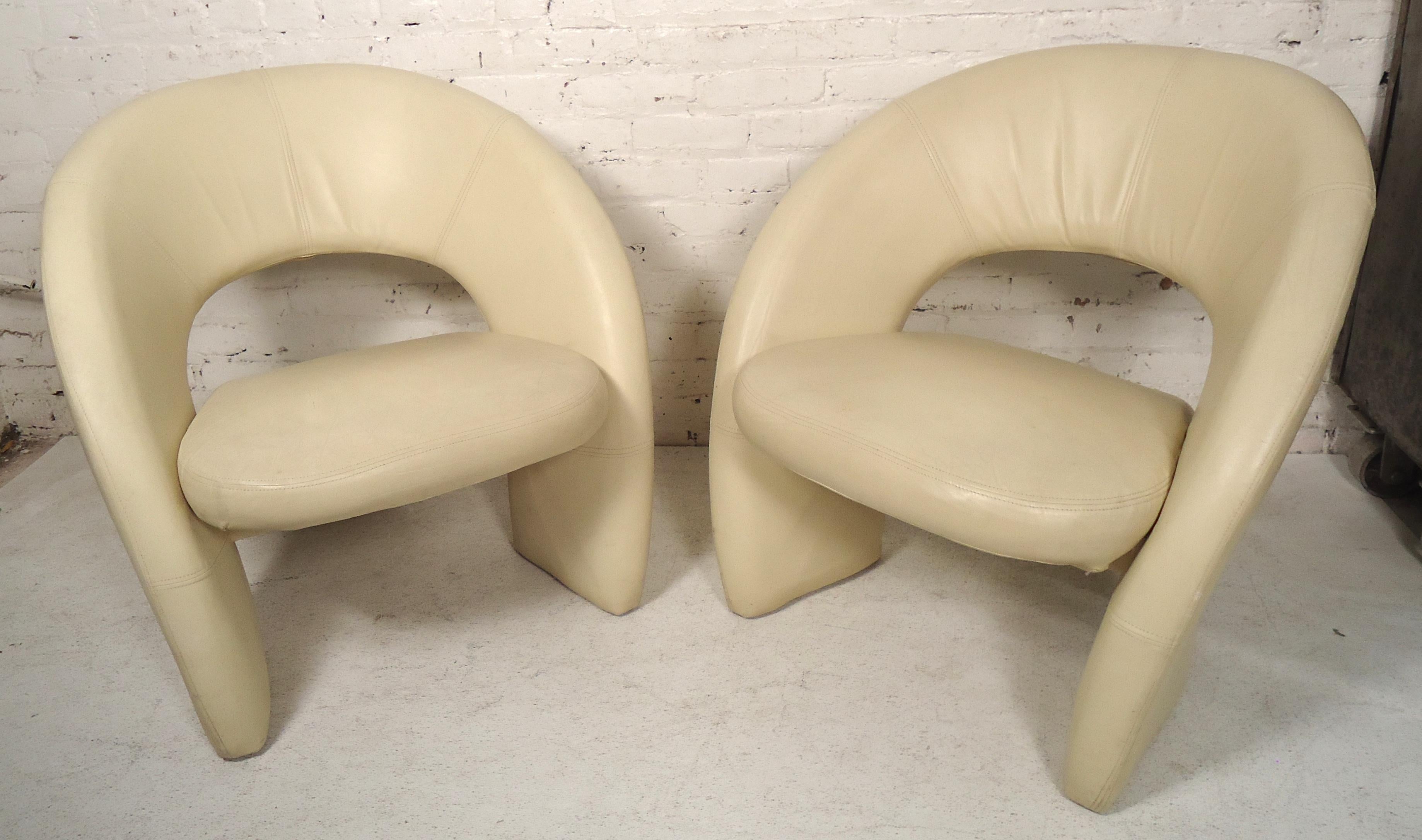 Pair of leather chairs with wild sculpted design.

(Please confirm item location - NY or NJ - with dealer).
 