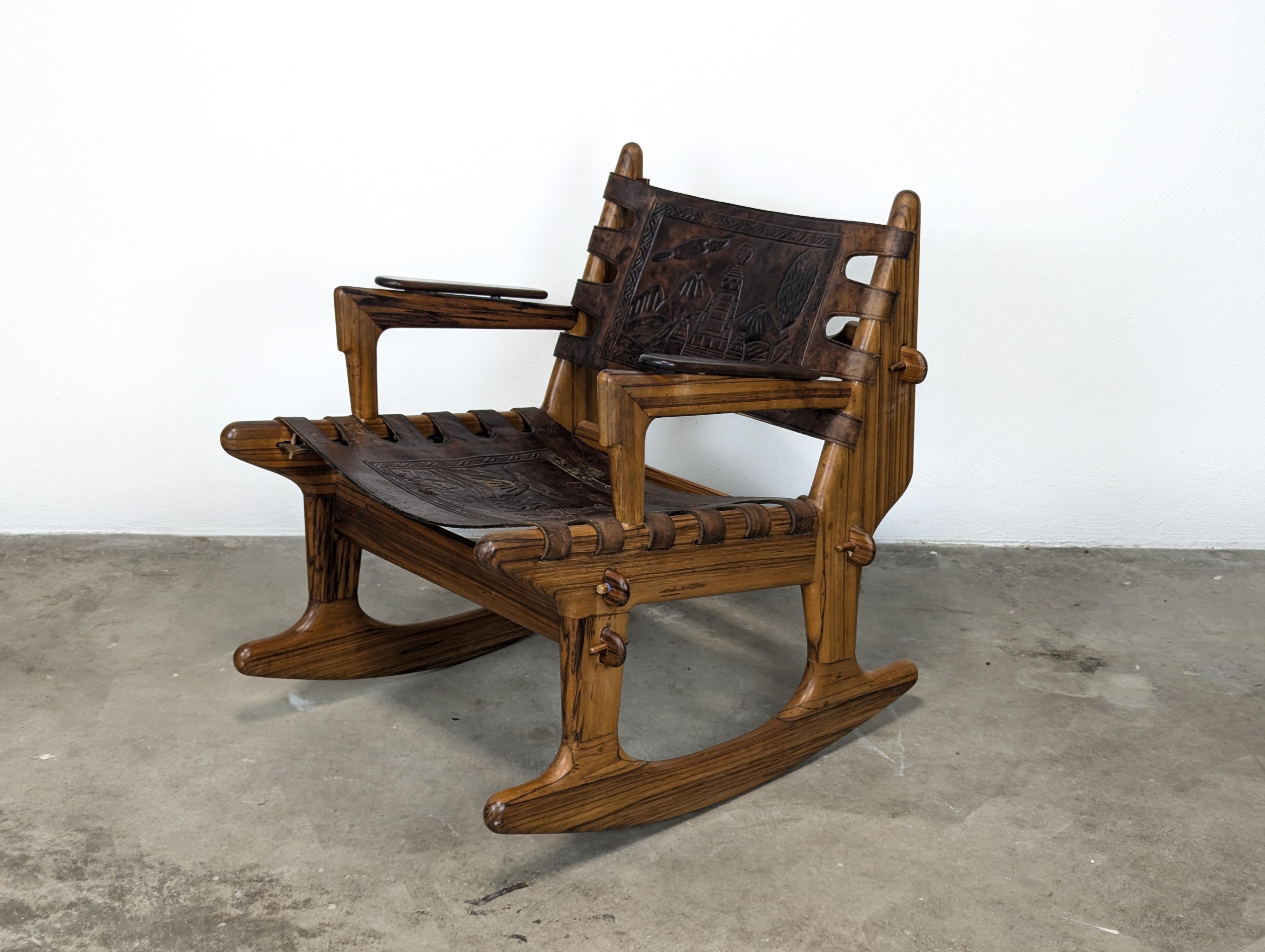 Introducing a stunning Mid Century Modern Leather & Rosewood Rocking Chair by the renowned designer Angel Pazmino, dating back to the 1960s. This exquisite piece showcases the exceptional craftsmanship of the era, featuring interlocking frames held