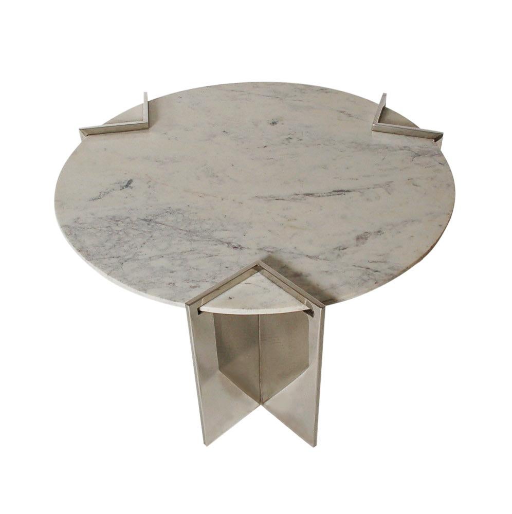 A smaller scale circular coffee table designed by Leon Rosen and manufactured by Pace in the 1970s. It features a thick marble slab suspended by three stainless steel braces. In beautiful well cared for condition.