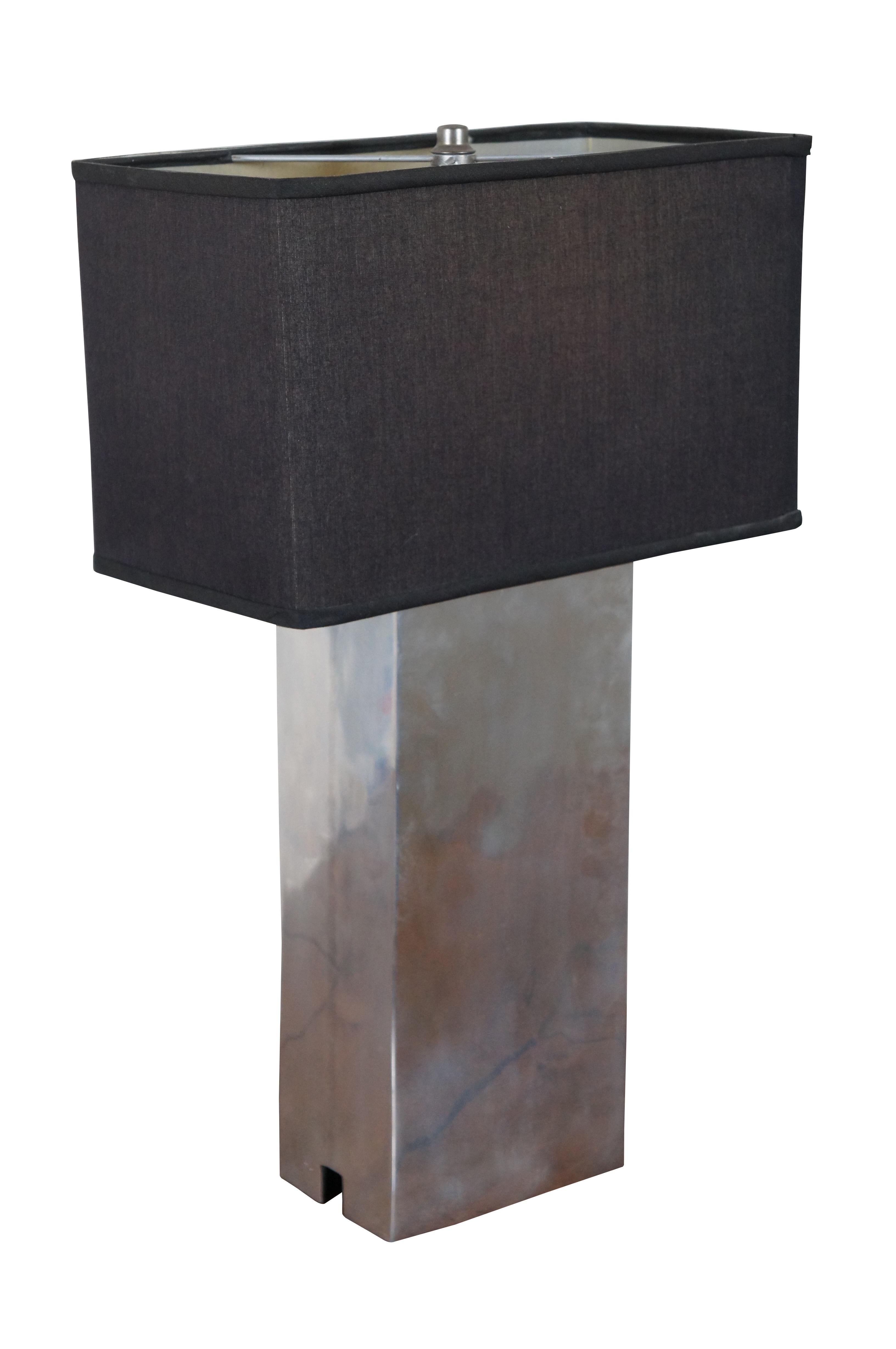 Mid-Century Modern table lamp by Leonard R. Foss featuring rectangular form with chrome finish and black shade. 

Measures: 6.25” x 4.5” x 17.5” / shade - 13.75” x 7” x 8.25” / total height – 22.75” (width x depth x height)