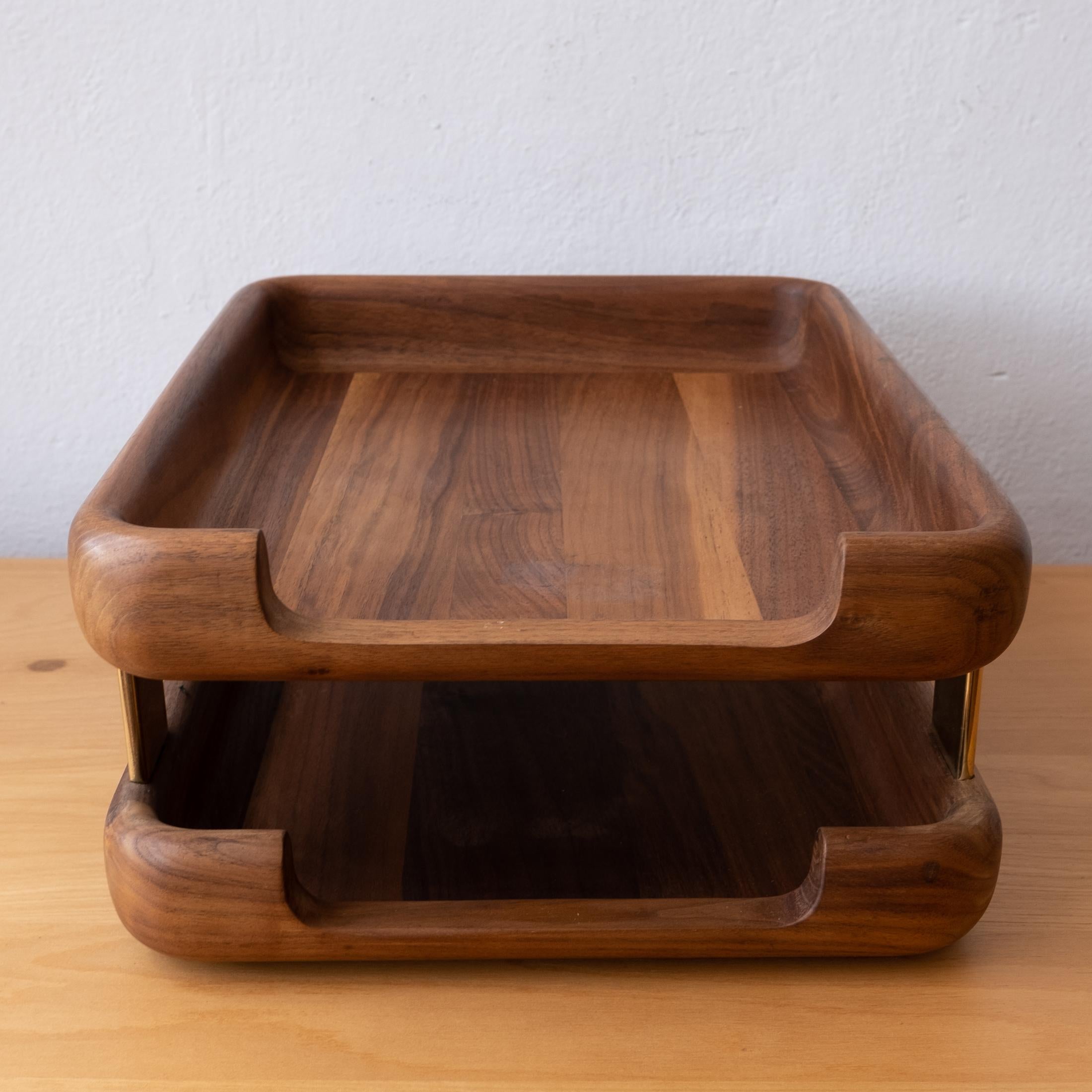 A high-quality solid walnut letter tray with brass elements. Substantial construction with two levels. Rounded smooth corners with a felt-lined bottom.