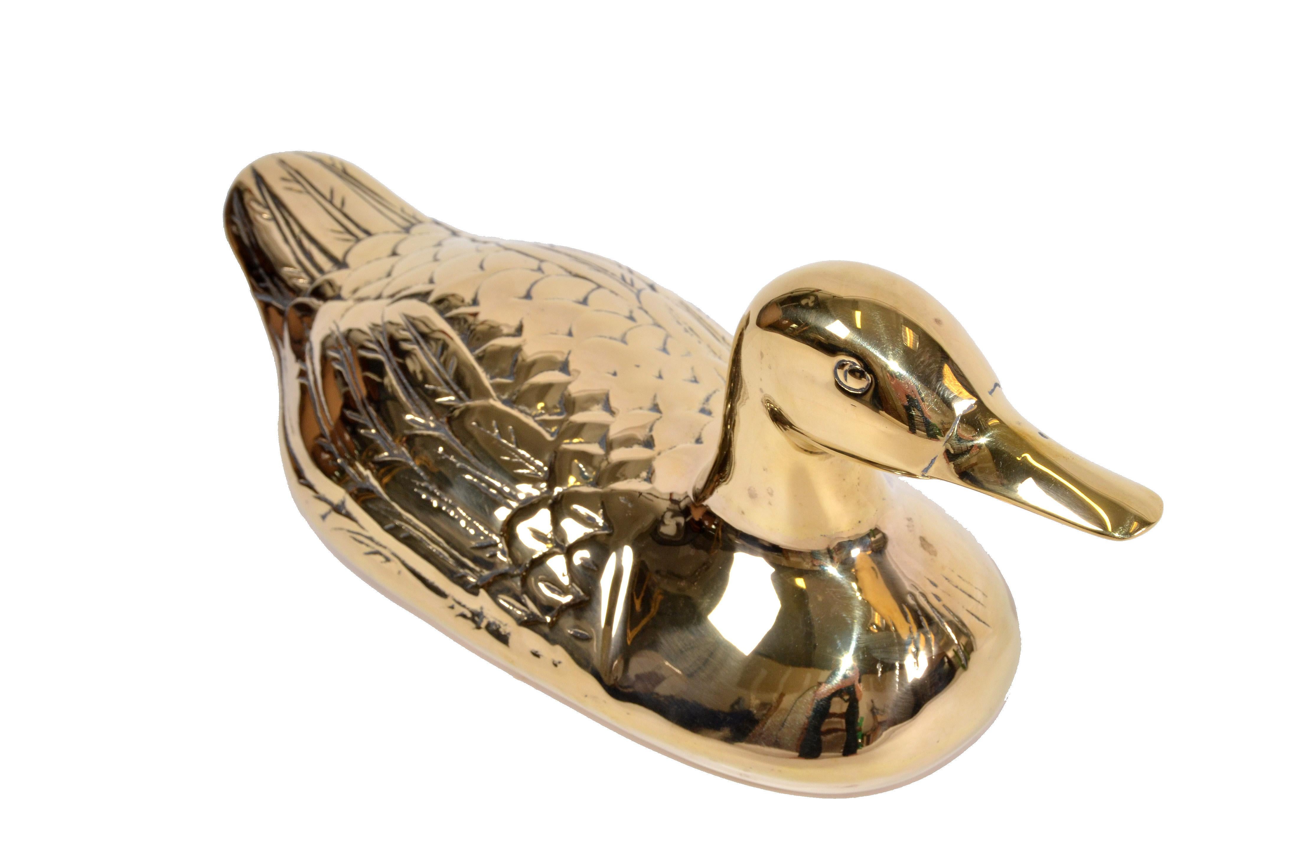 Mid-Century Modern polished decorative heavy bronze duck, animal sculpture or table decor.
Great Gift Idea for the Holiday Season.   