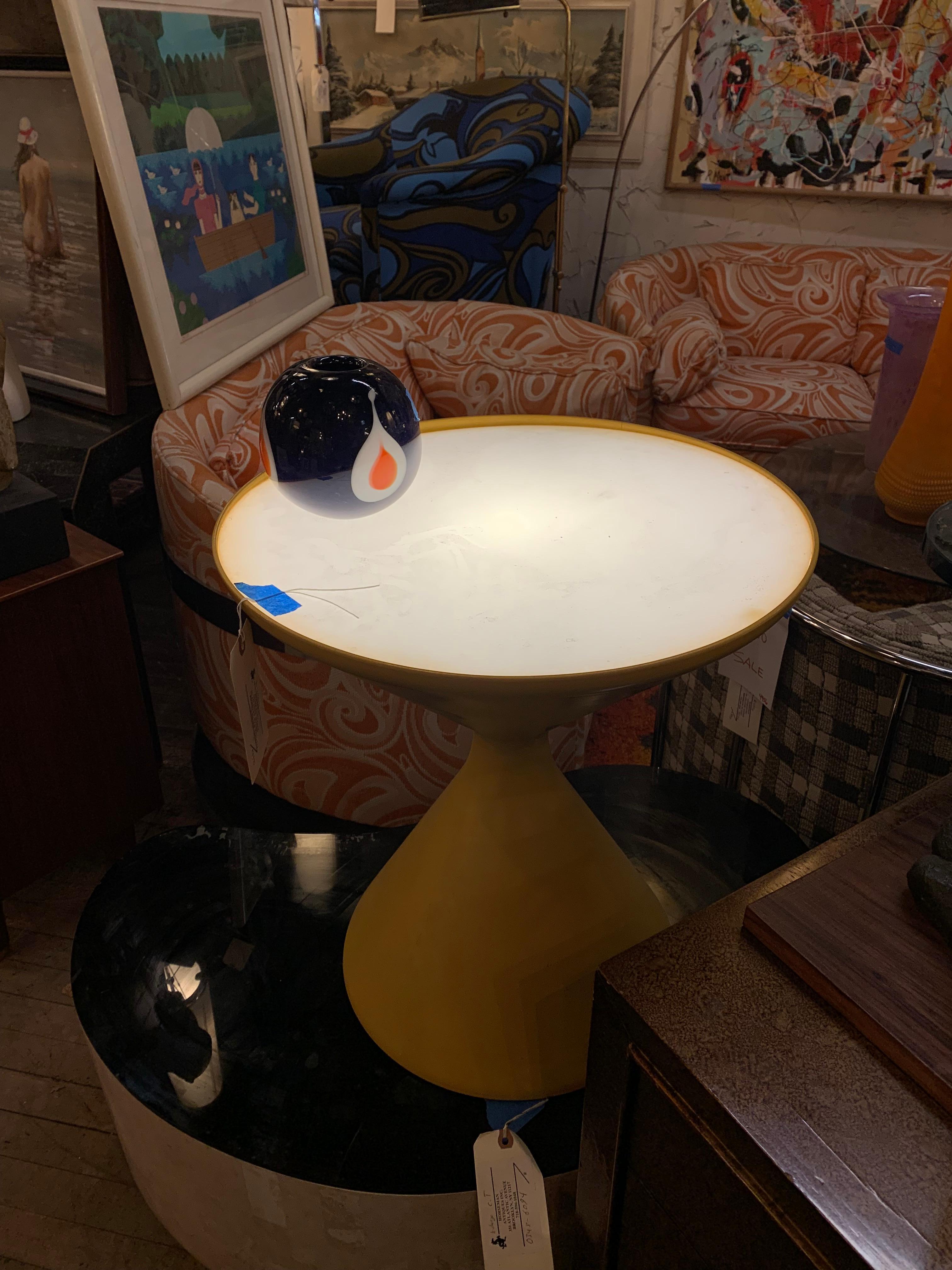 This unique table's surface is lit from underneath. Classic modern yellow color with an hour class shape. 
(Please confirm item location - NY or NJ - with dealer).
 