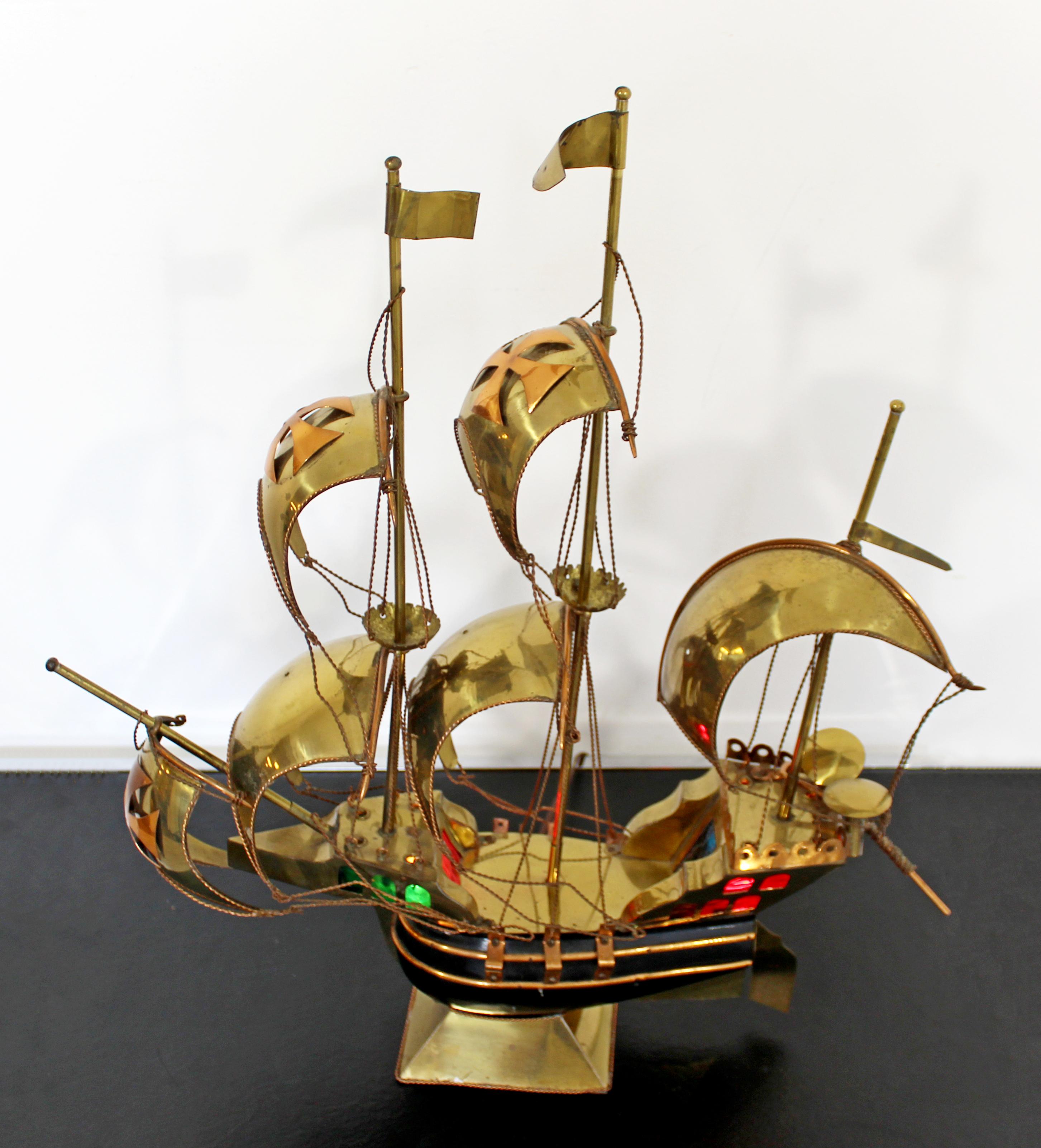 For your consideration is a unique, light up, brass and copper table sculpture of a sailboat, circa 1970s. In very good vintage condition. The dimensions are 22