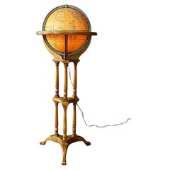 Soporte moderno de mediados de siglo para Globe Lighting de Butler