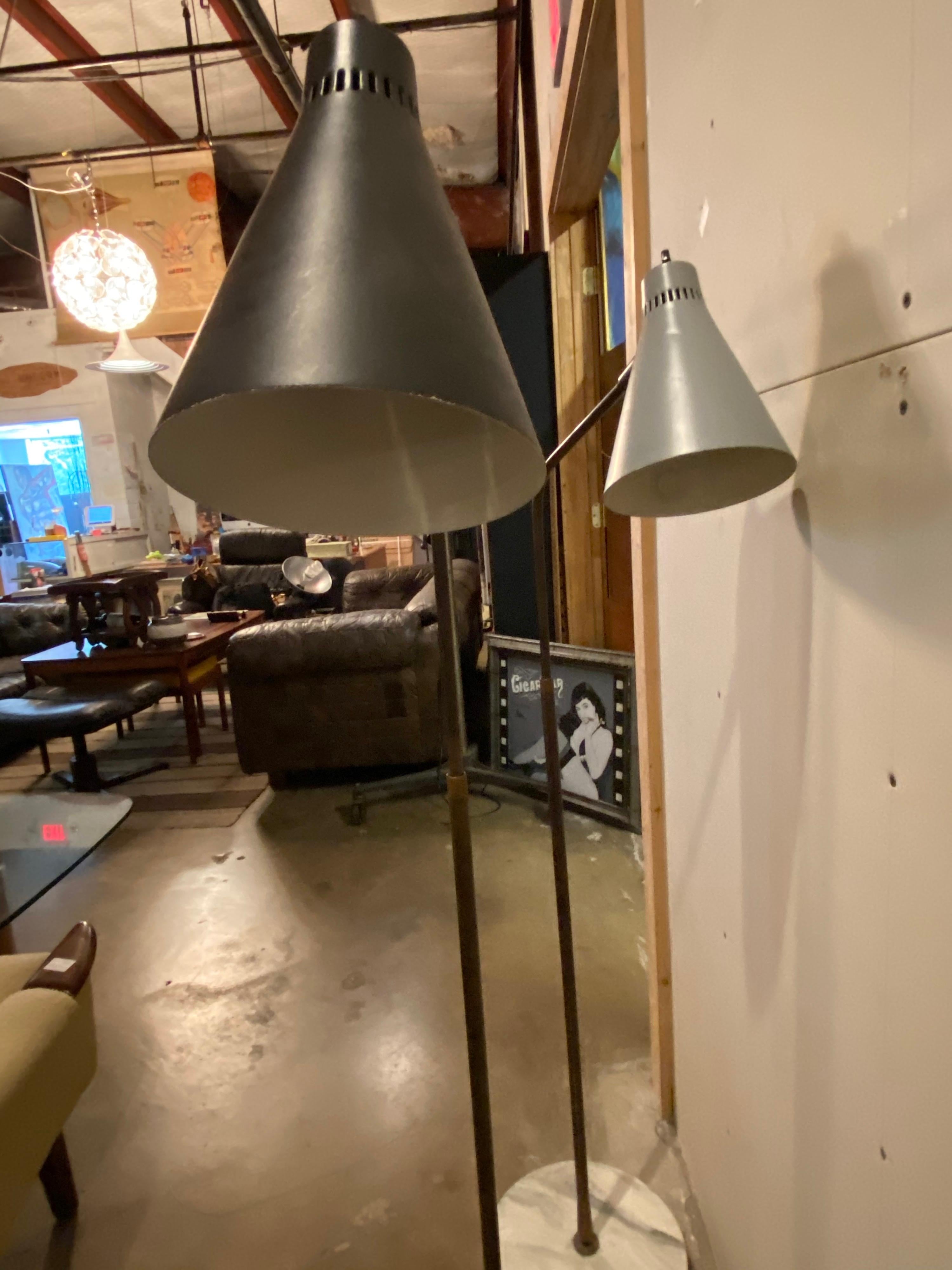 Beautiful Italian adjustable floor lamps designed by Giuseppe Ostuni for Oluce, also known for being the oldest active lighting company in Italy. These lamps can be purchased individually and are in good condition, wear is consistent with age. One