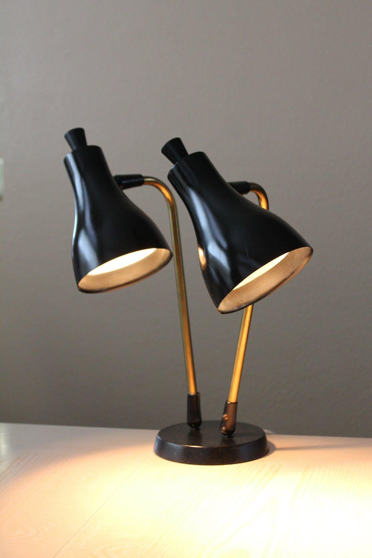 ICONIC!

Simply BEAUTIFUL Black
LIGHTOLIER DUAL SHADE DESK/TABLE LAMP
By GERALD THURSTON

Does your Case Study House need new lamps? This marvelous specimen is sure to be a welcome addition!

These lamps, penned by Gerald Thurston the in-house