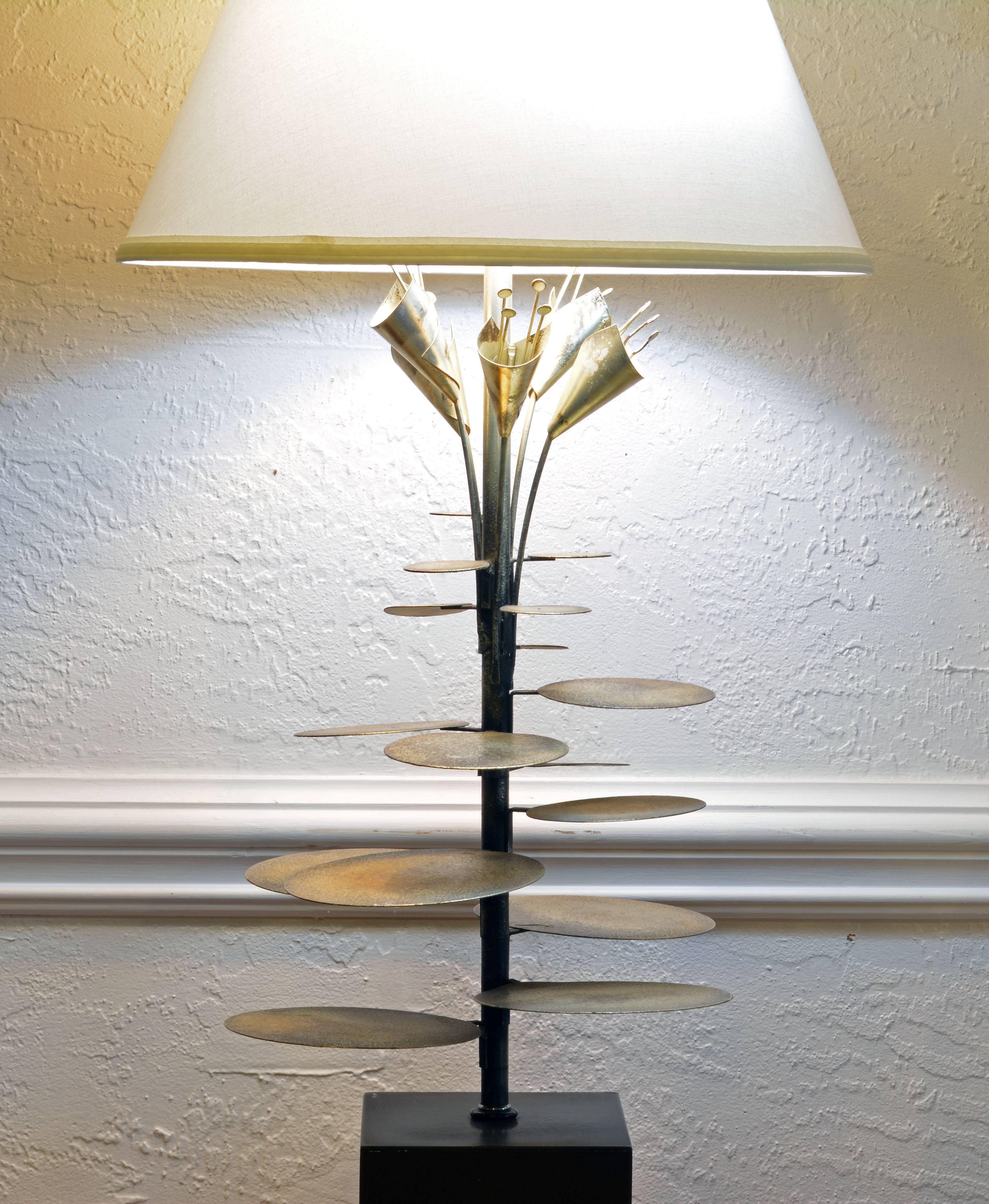 A wonderful likely custom-made lamp attributed to Curtis Jere featuring silver patinated stems and leaves rising from a square painted base and ending I stylized flowers. It includes a new pristine white shade. Height measurement below refer to the
