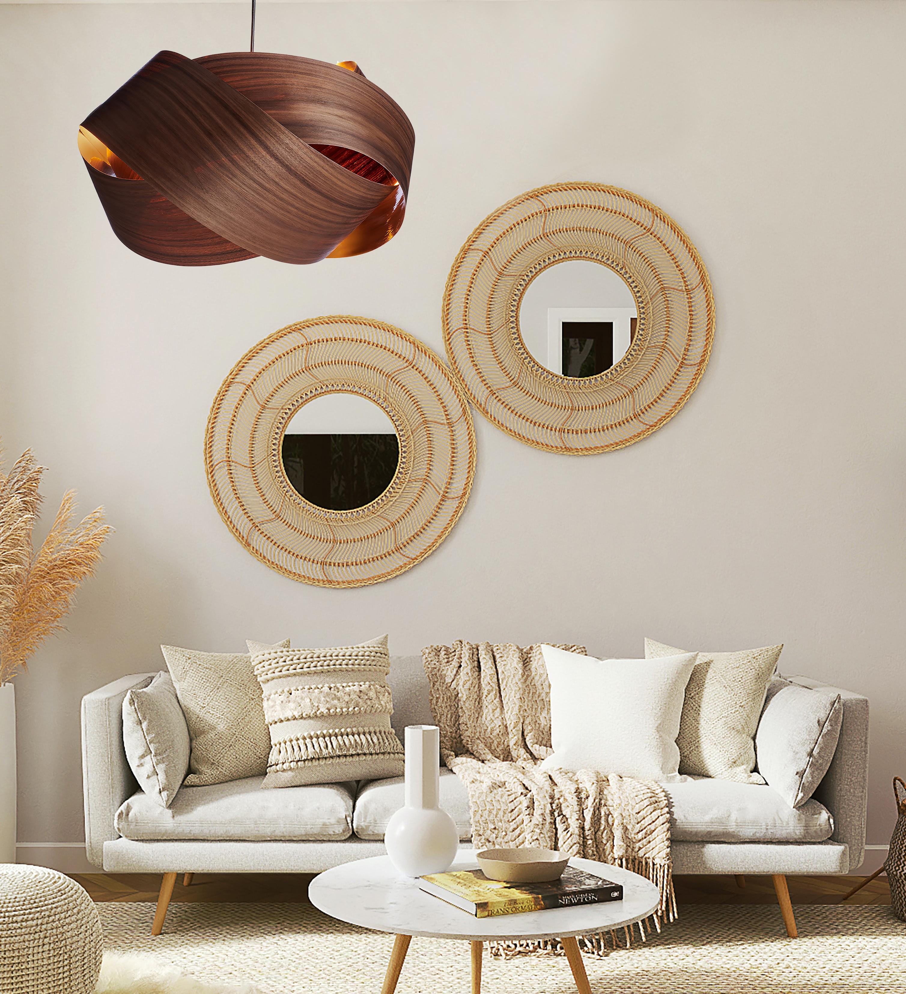 This pendant light combines Mid-Century Modern and Scandinavian design, offering a sleek yet organic look. Crafted from walnut wood veneer, known for its rich grain and dark tones, the wood’s beauty is enhanced through sanding and oiling. Each piece