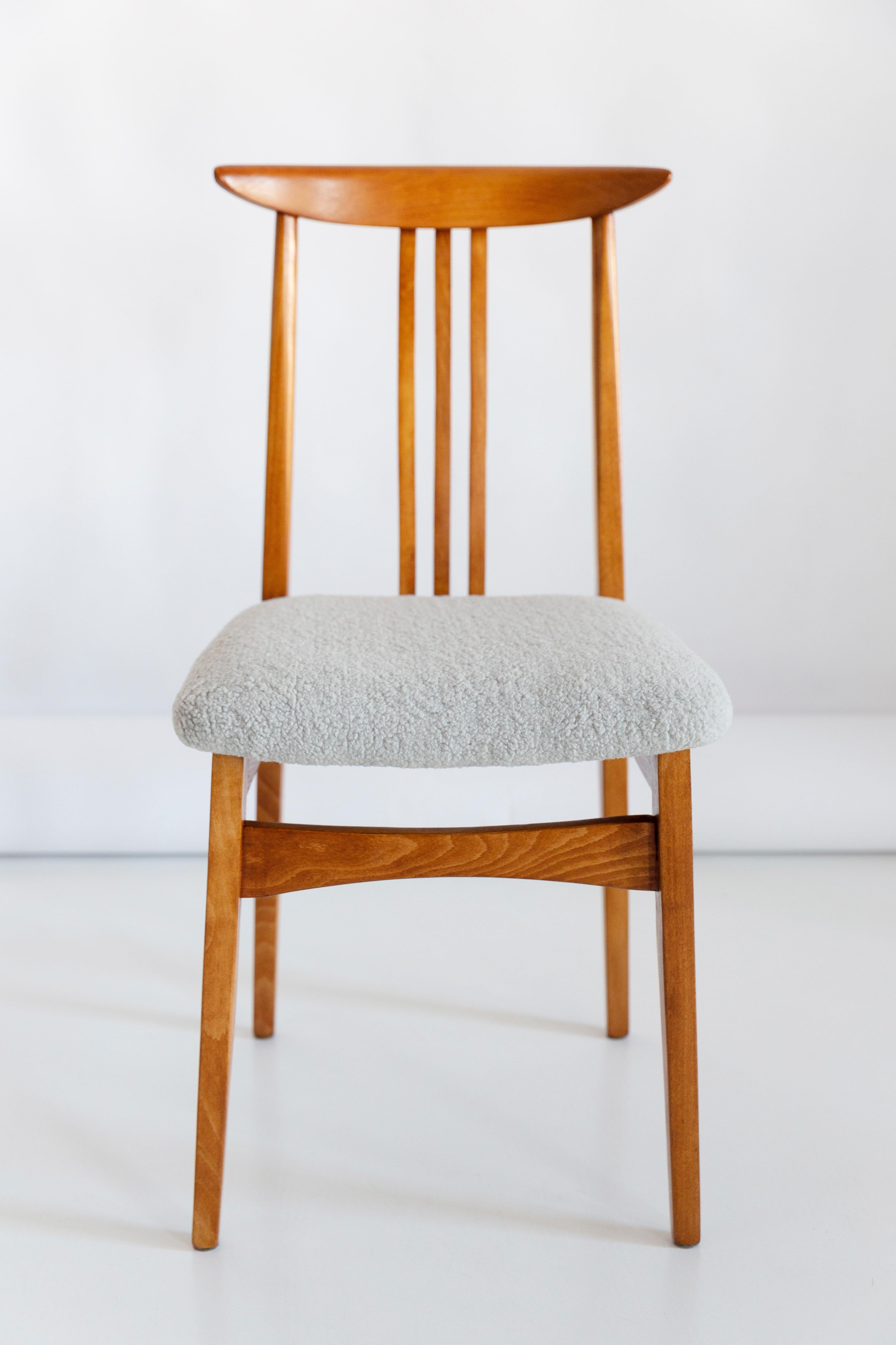 A beautiful beech chair designed by M. Zielinski, type 200 / 100B. Manufactured by the Opole Furniture Industry Center at the end of the 1960s in Poland. The chair is after undergone a complete carpentry and upholstery renovation. Seats covered with