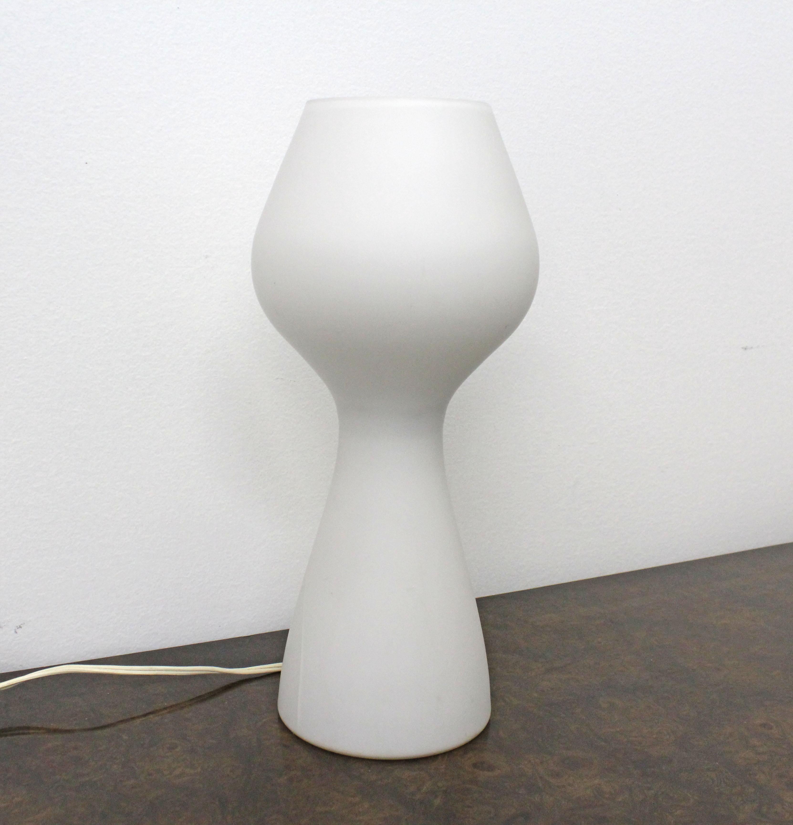 Offered is a vintage table lamp, similar to the style of Lisa Johansson-Pape's mushroom lamp. It is made of glass with a frosted appearance. It is in good working condition, has been tested, shows some surface wear. There is a crack under the glass