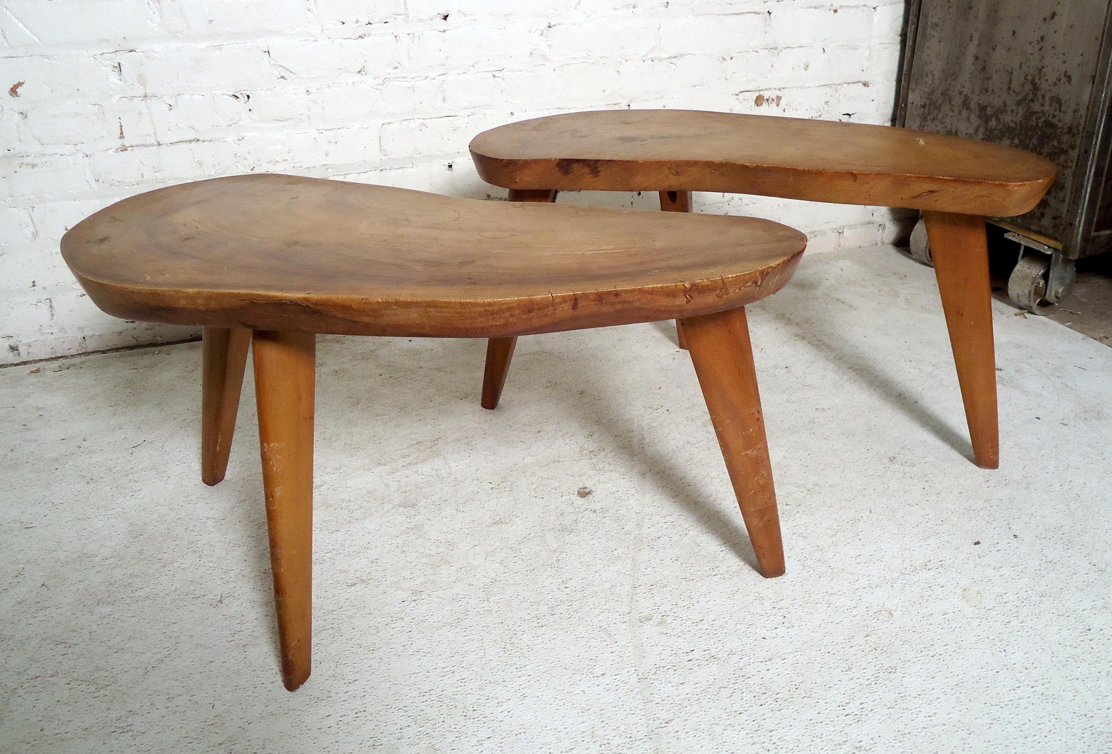 Pair of vintage modern live edge side tables featured on three sturdy legs. These tables would make a great addition to any home.

Please confirm item location (NY or NJ) with dealer.
