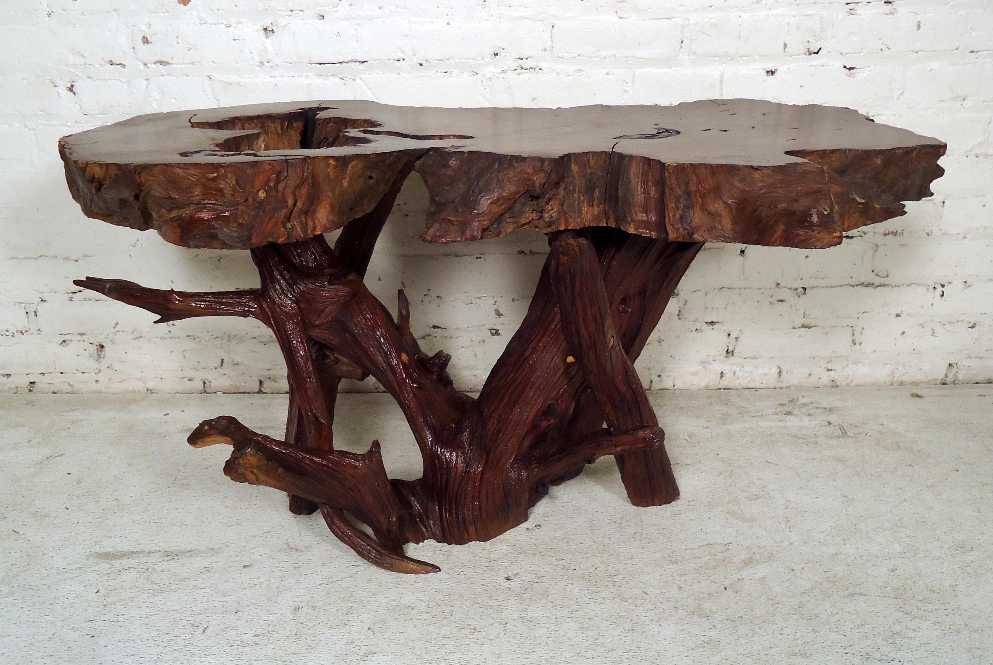 This beautiful vintage modern live edge bench features a unique tree slab top with elegant wood grain. This stunning live edge table offers a taste of nature within any modern interior. Please confirm item location (NY or NJ).