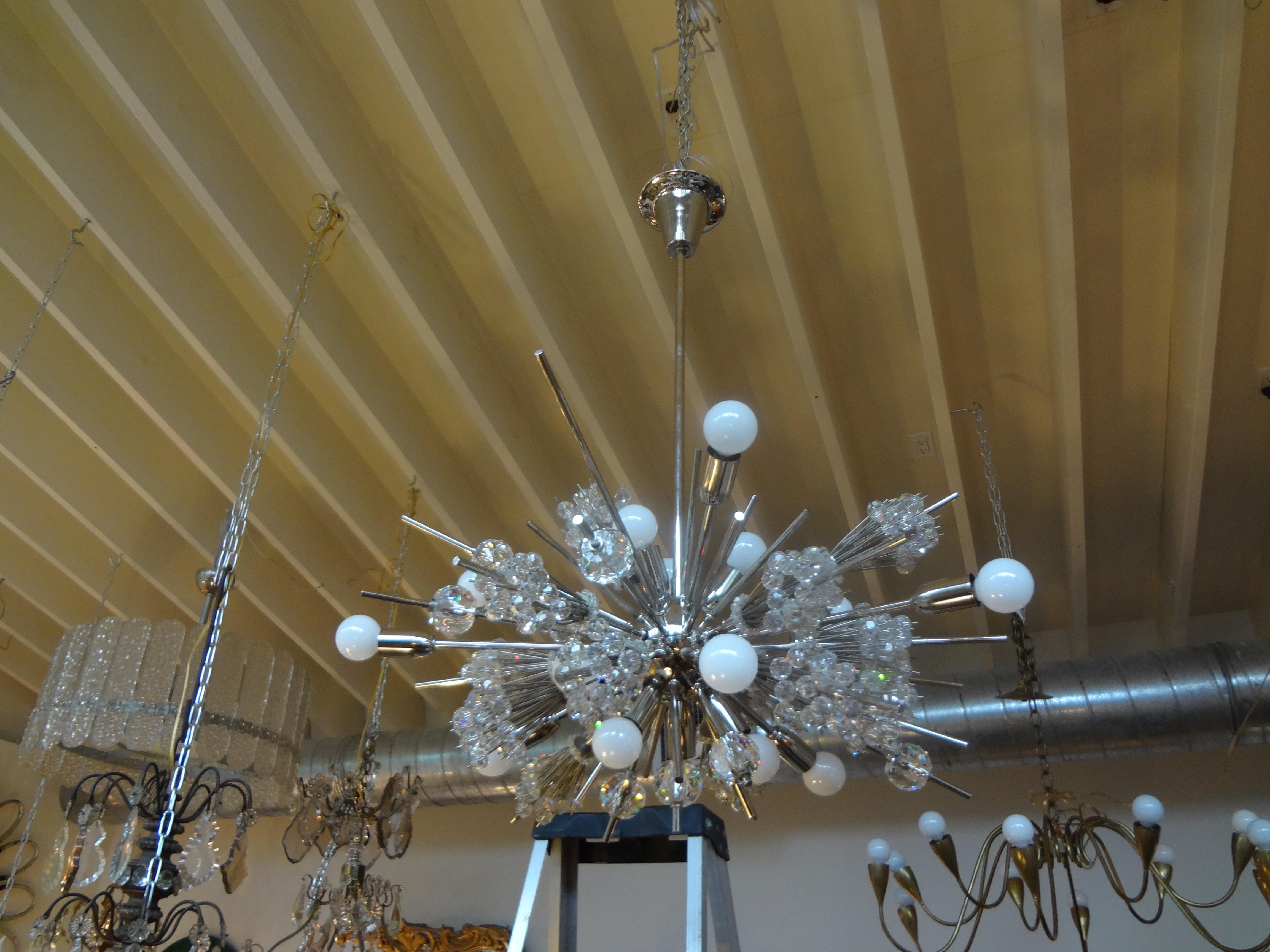 Mid-Century Modern Lobmeyr Metropolitan Opera exploding star chandelier, circa 1960s. This stunning iconic chandelier creates the effect of a starburst in handcut Austrian crystals. This Sputnik chrome and glass chandelier was designed in the 1960s