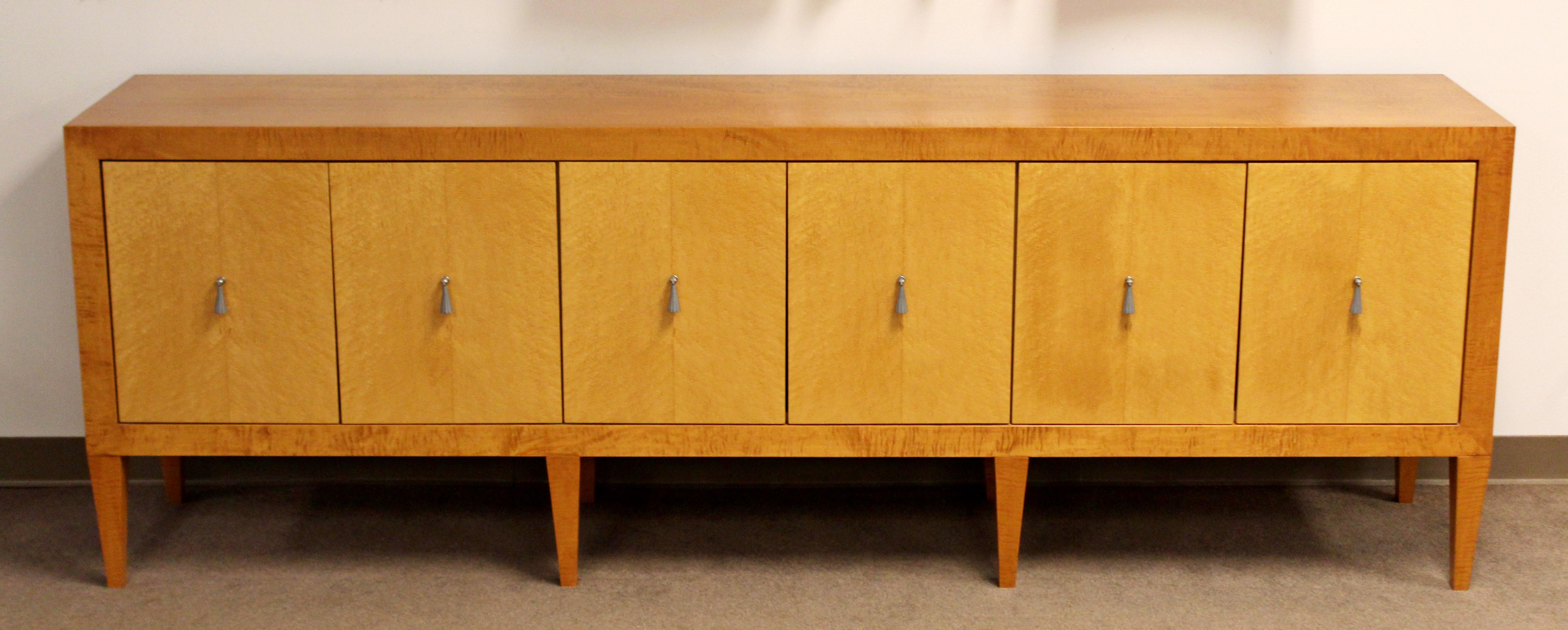 For your consideration is a beautiful long blonde wood credenza, with lovely aluminum pulls, by Baker, circa 1970s. In excellent condition. The dimensions are 96